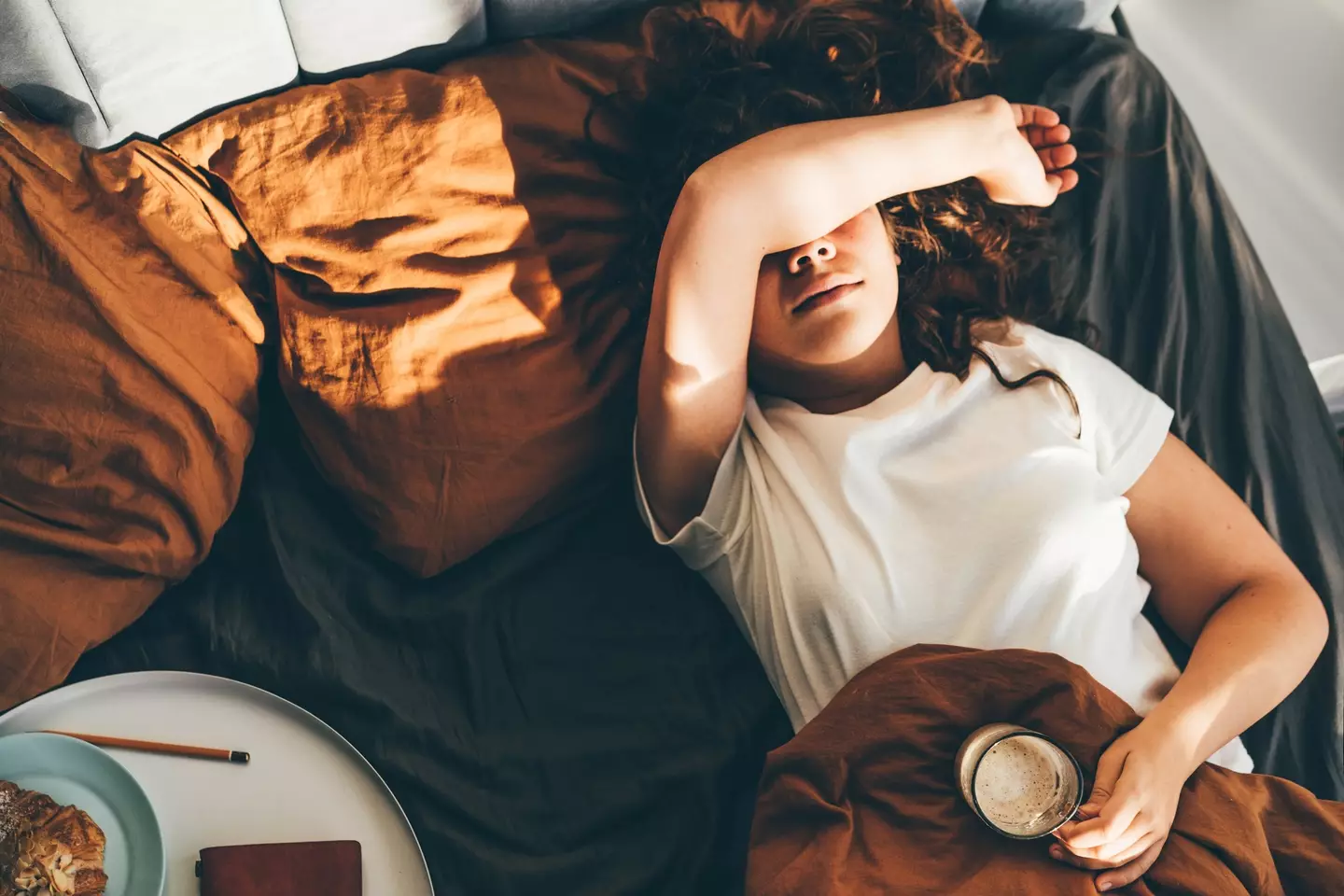 There are a bunch of reason why we may not feel our best as we wake up (Maria Korneeva / Getty Images)