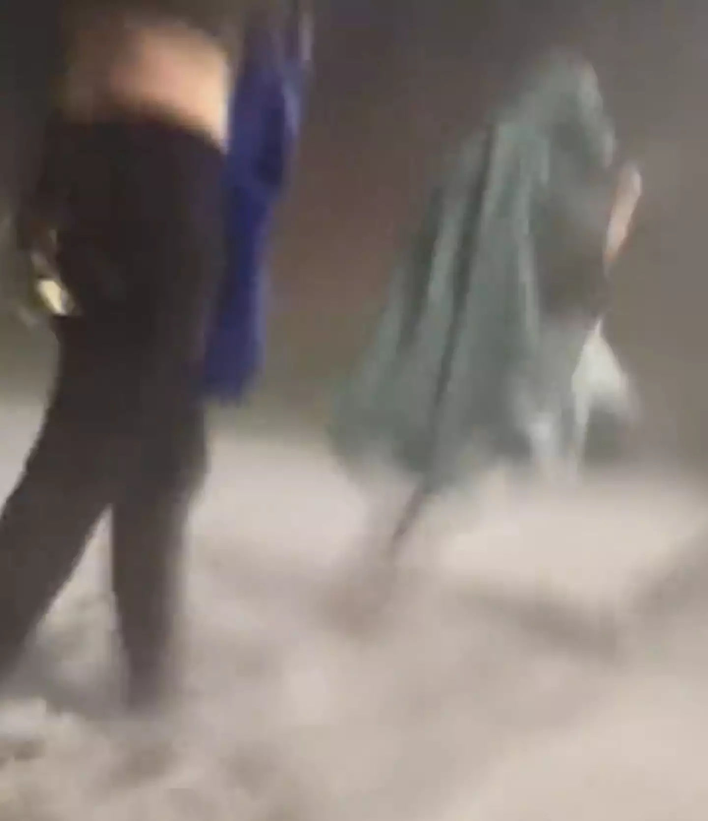 Concertgoers flee the hail.