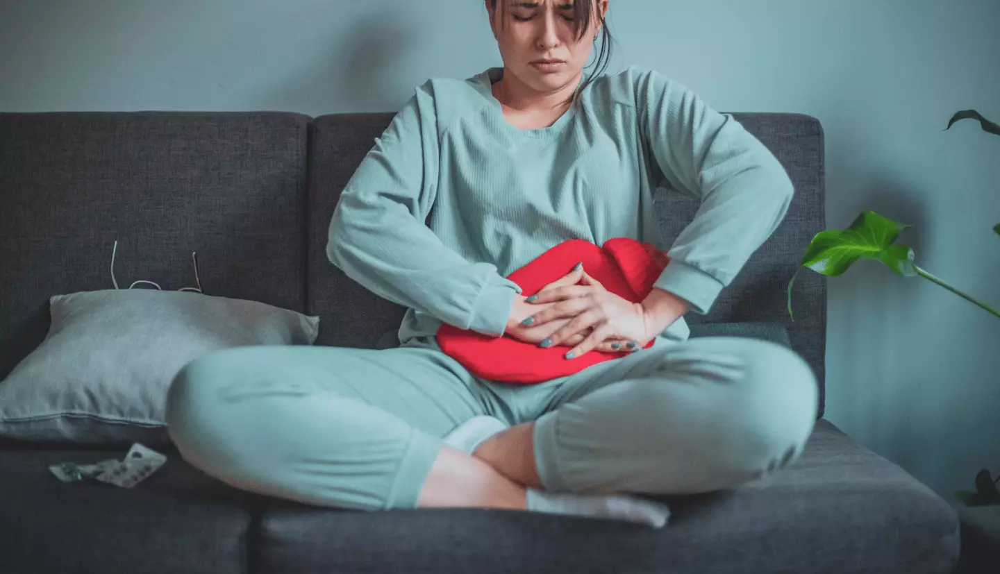 Experts have explained what 'period flu' actually is (Getty Stock Images)