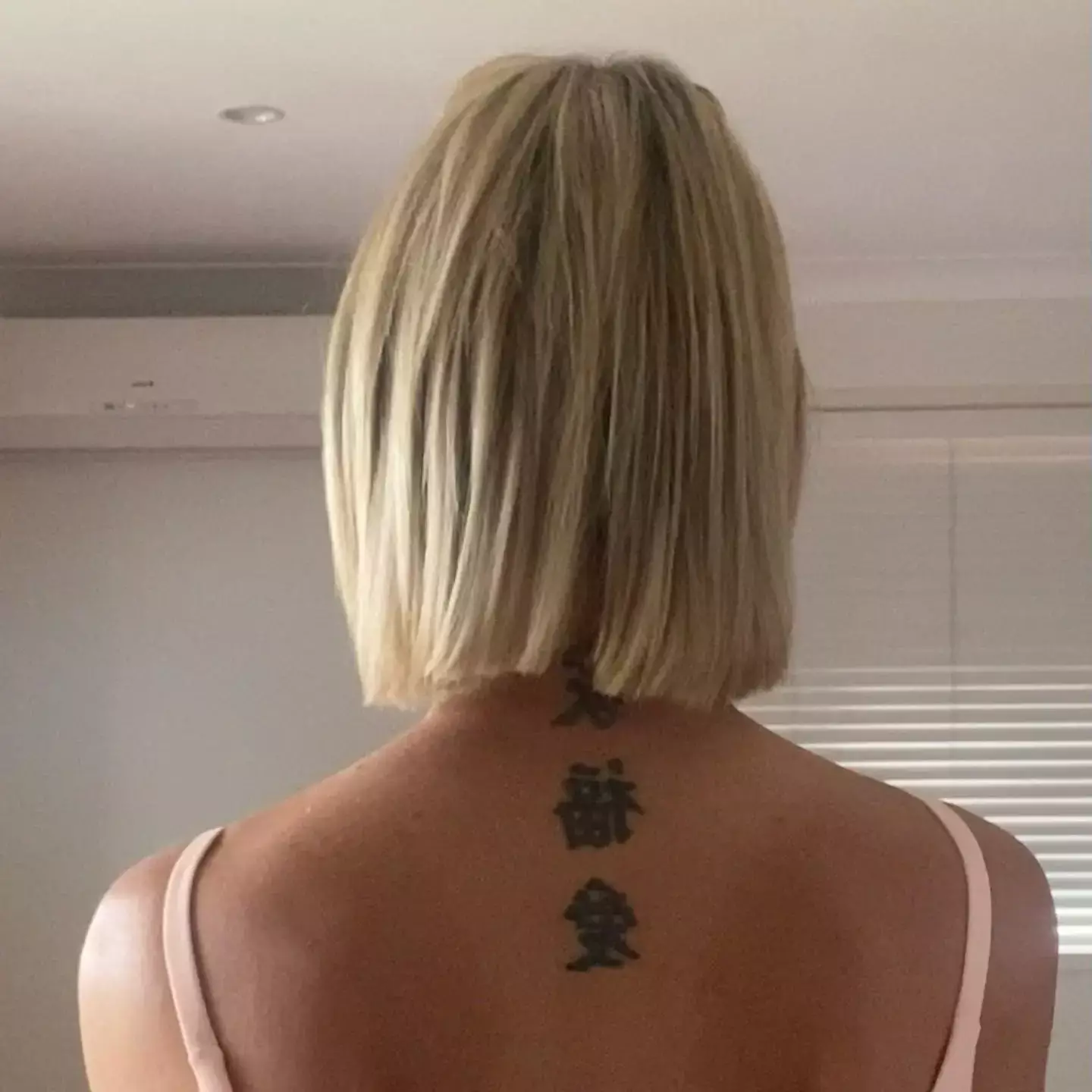 Katie Hally says she was turned away from the venue due to her tattoos.