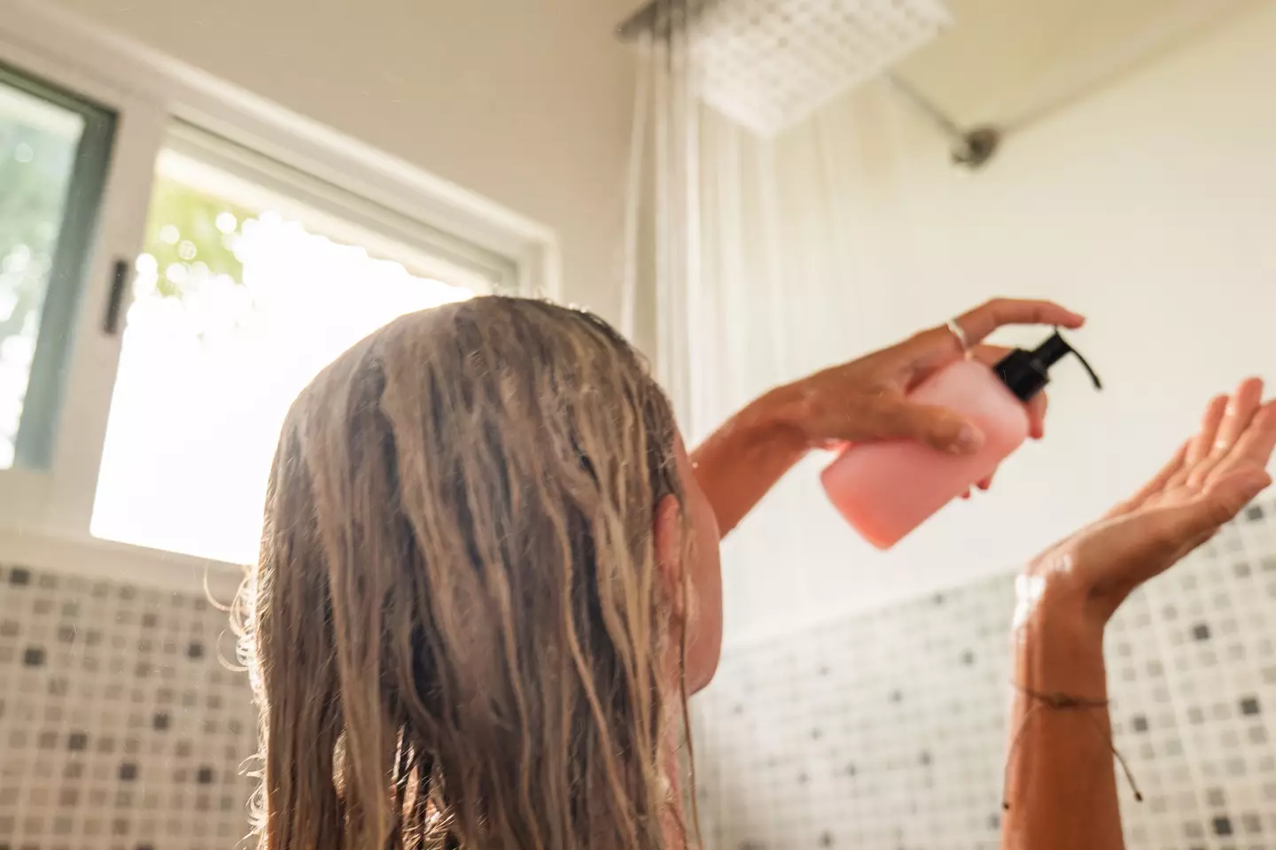 A loss of smell is an early sign of Alzheimer's, and this can be particularly notable while in the shower when using products like shower gel (Getty Stock Image)