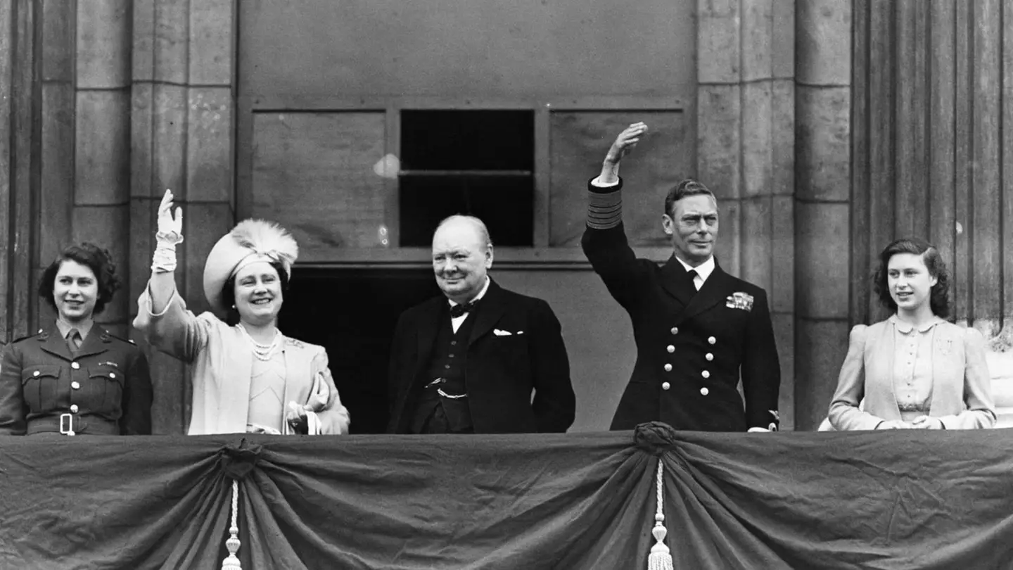 Wiston Churchill with King George VI and Queen Elizabeth the Queen Mother and Princesses Elizabeth and Margaret on VE Day.