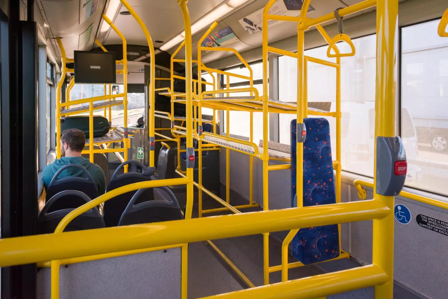 A woman was grabbed and kicked out of her seat on an otherwise empty bus.