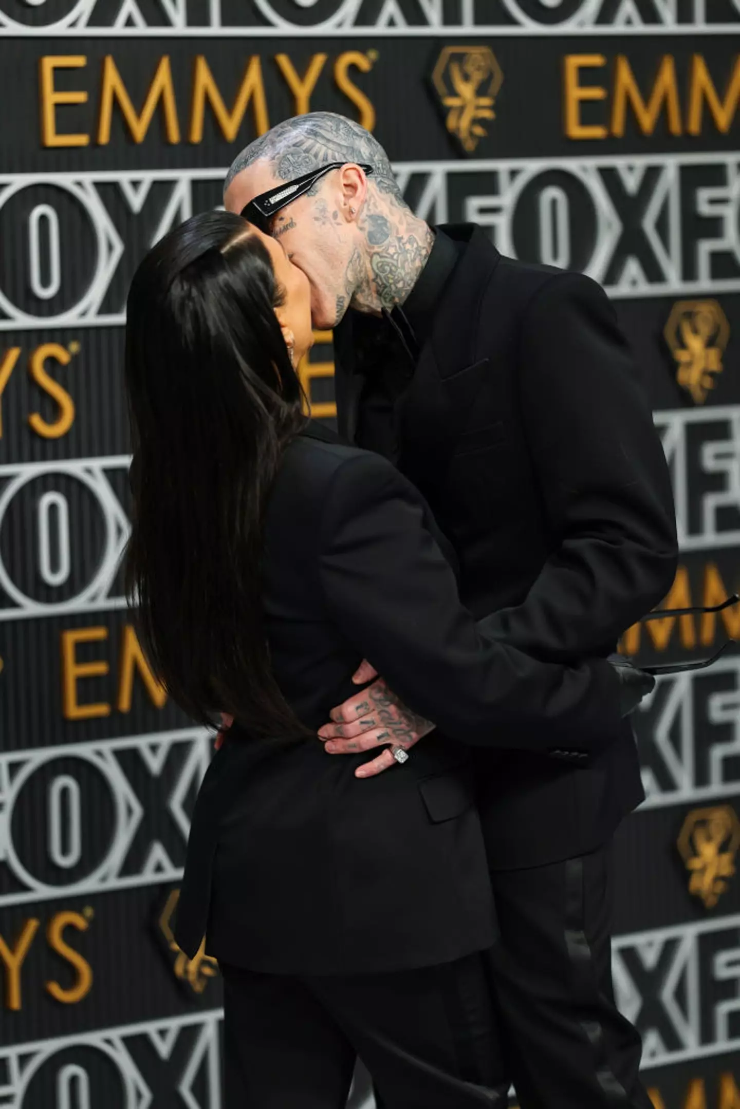 The two are not shy when it comes to PDA. (Neilson Barnard / Staff / Getty Images)