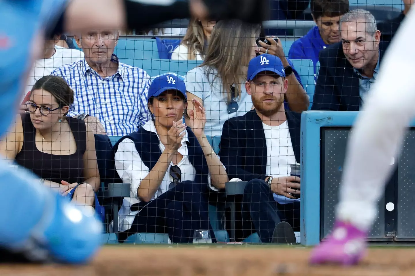 They were sporting blue caps to throw their support behind the LA Dodgers (Ronald Martinez/Getty Images)