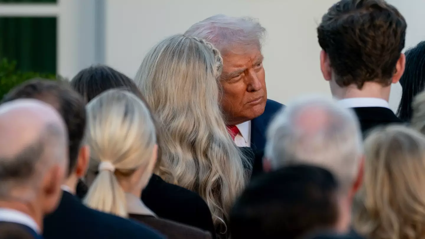Donald Trump speaks with Charlie Kirk’s parents as he awards their son with posthumous award