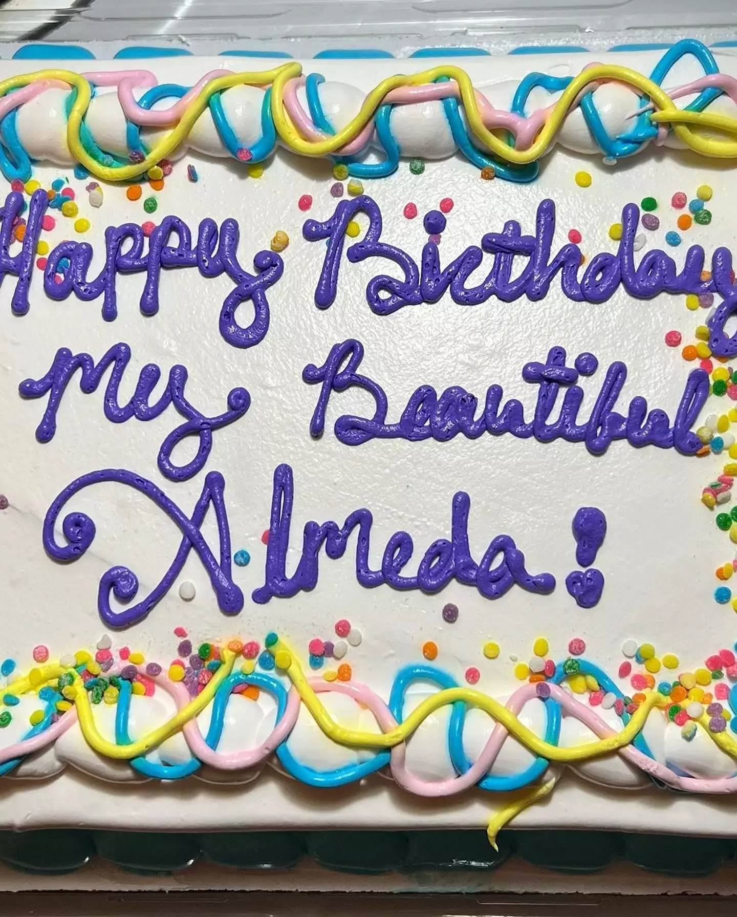 He gave a cake to his 'beautiful' wife.