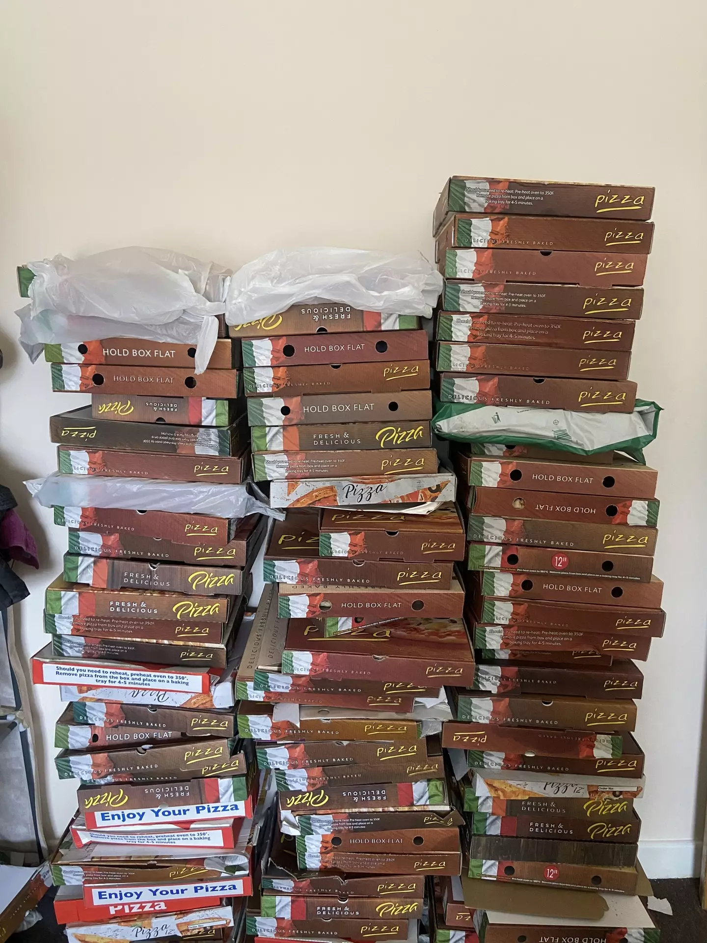 The pizza boxes.