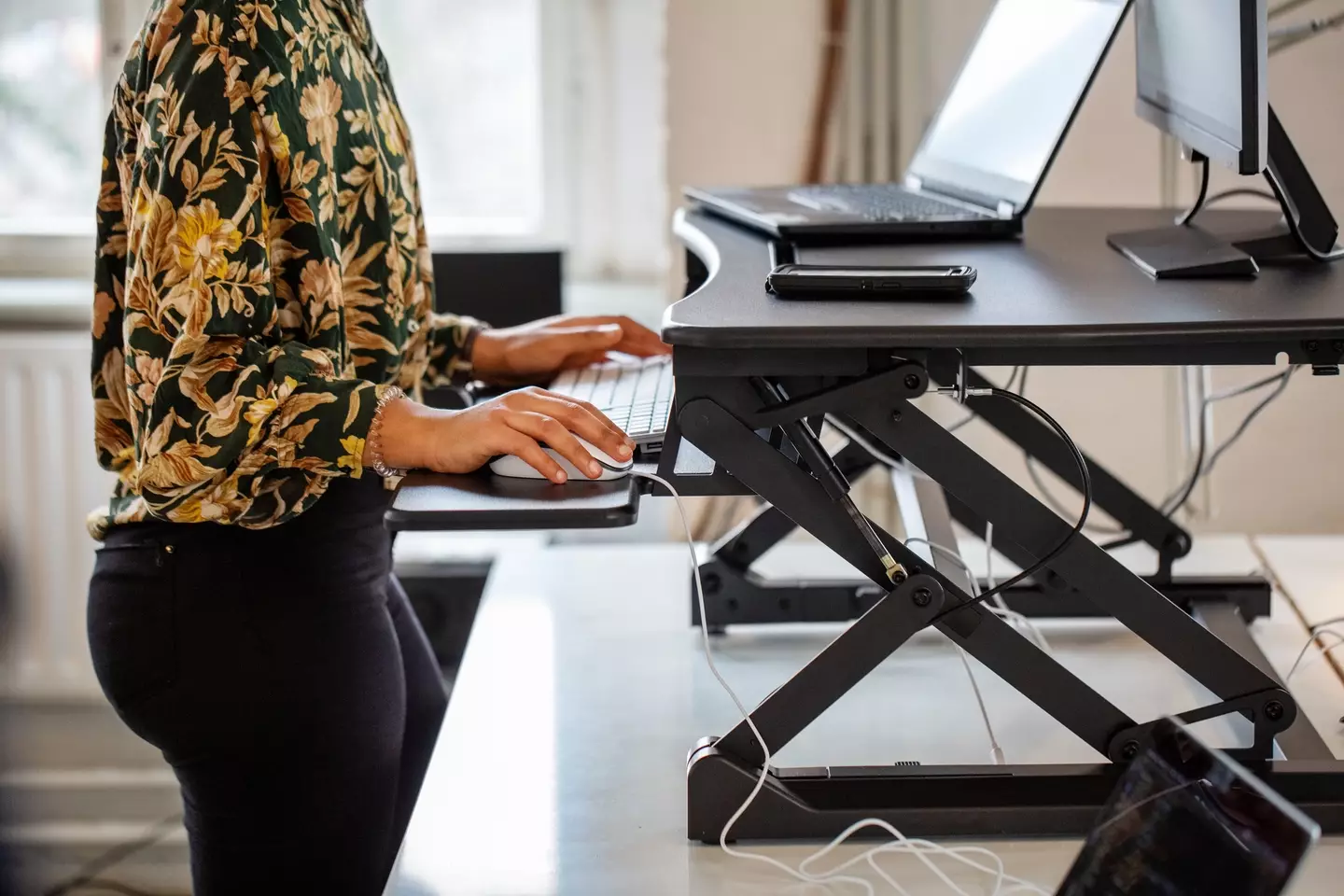 A standing desk is a good way to combat 'office chair butt' (Luis Alvarez / Getty Images)