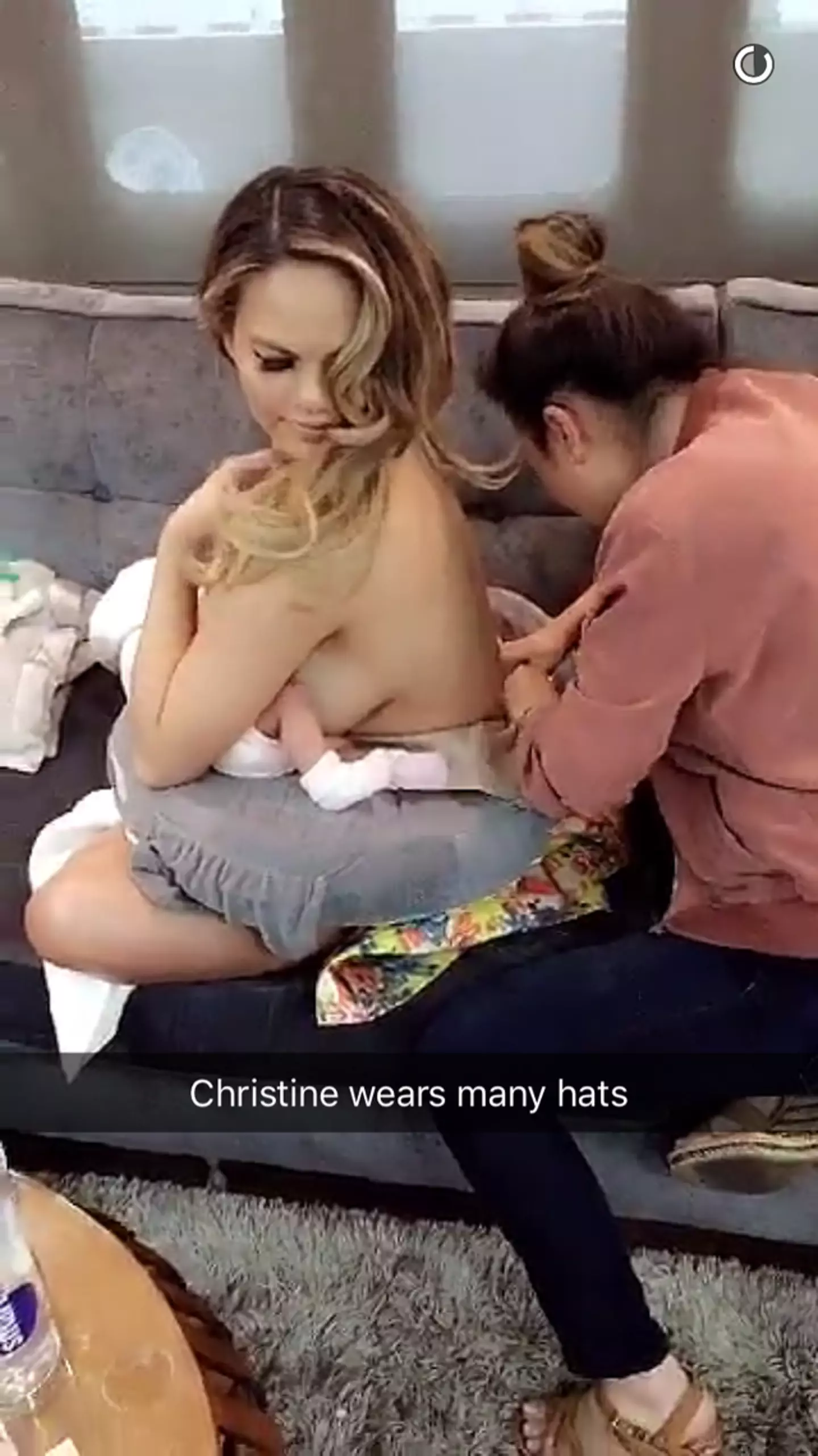 Chrissy Teigen posted on Snapchat, as she feed Luna.