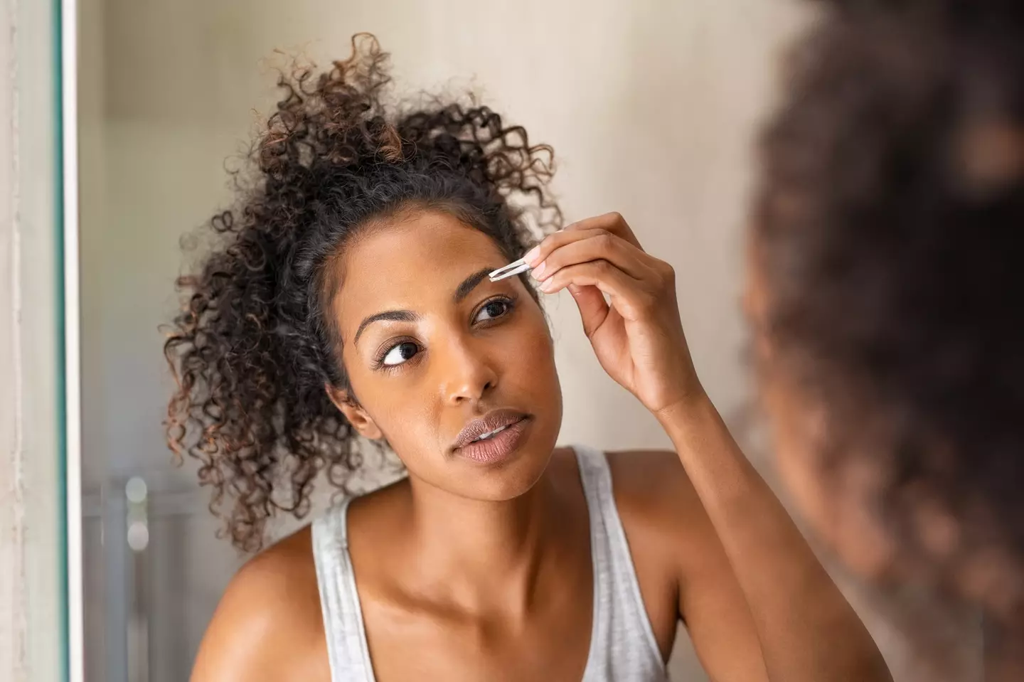 There are currently over 140.8 million posts about eyebrow blindness on TikTok. (Ridofranz / Getty Images)