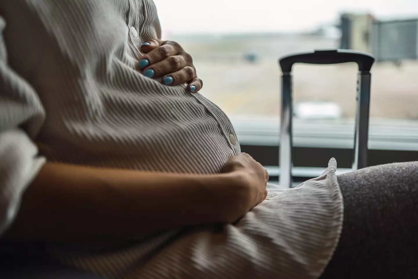 The pregnant woman asked the man to give up his seat so she could sit closer to the bathroom.