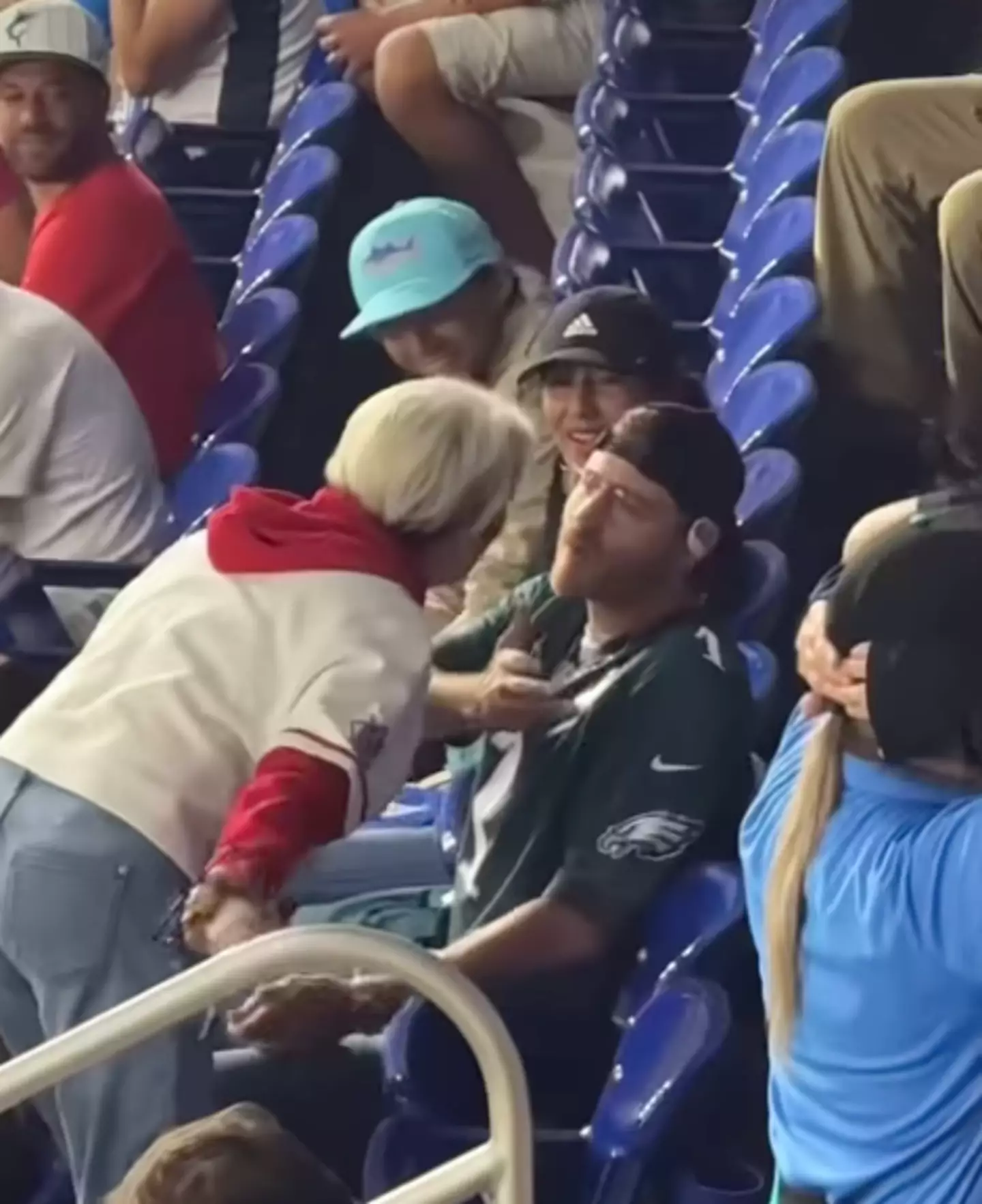 The woman can later be seen yelling in another fan's face (Snapchat/@bobbyvanriper)