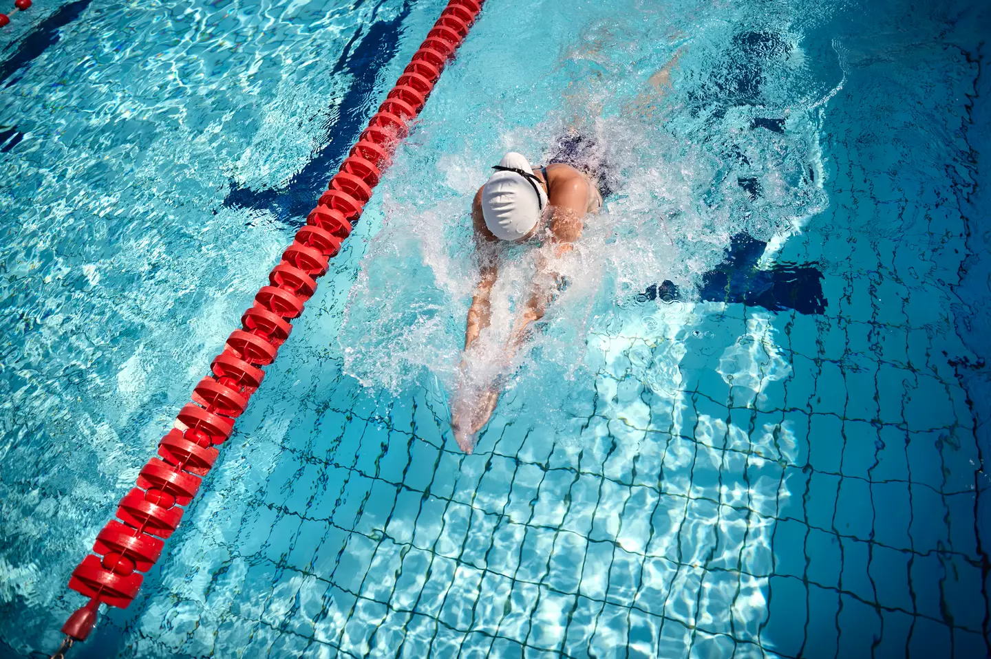 The caps are actually designed to help you swim faster. (Oliver Rossi/Getty)