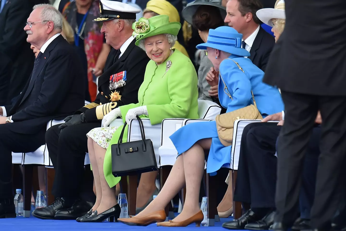 Queen Elizabeth II smiles whilst speaking to Queen Margrethe II of Denmark in 2014.
