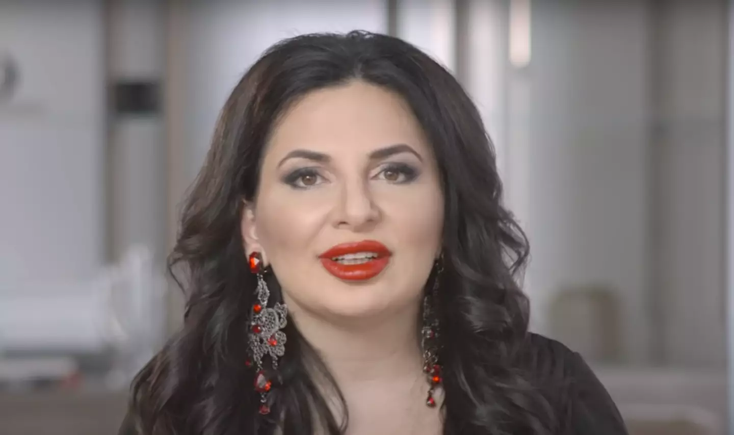 Attention has been drawn to Ignatova's security guard, Taki. (YouTube/OneCoin)