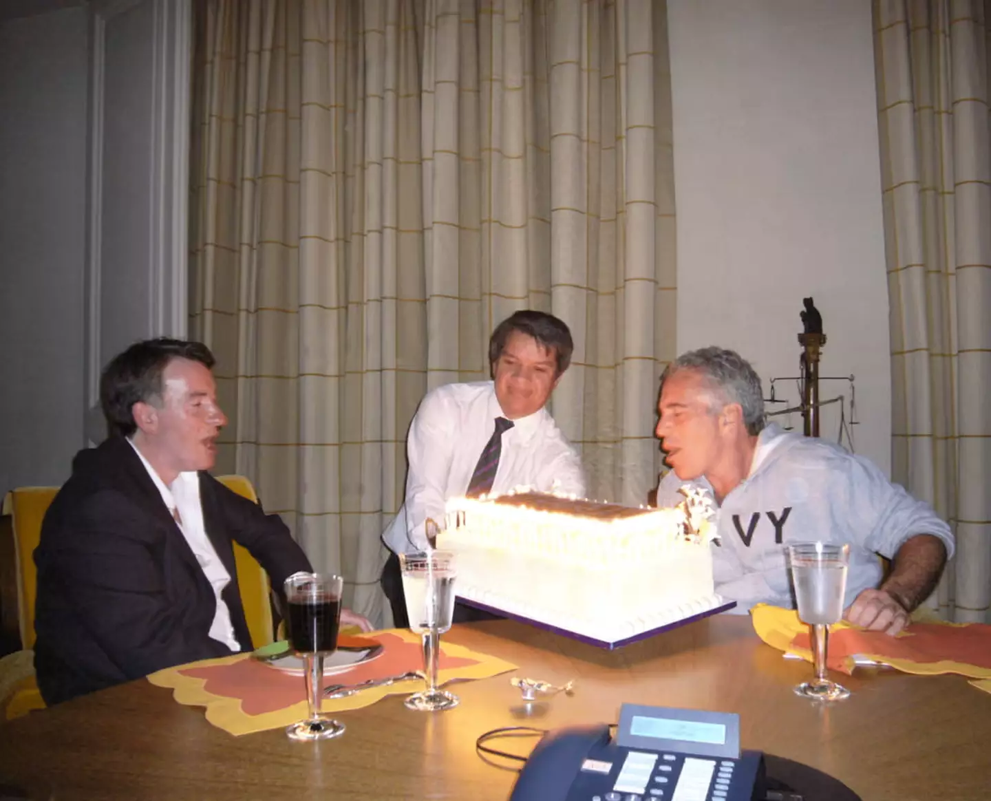 Mandelson is seen at what looks like a birthday celebration (Department of Justice)