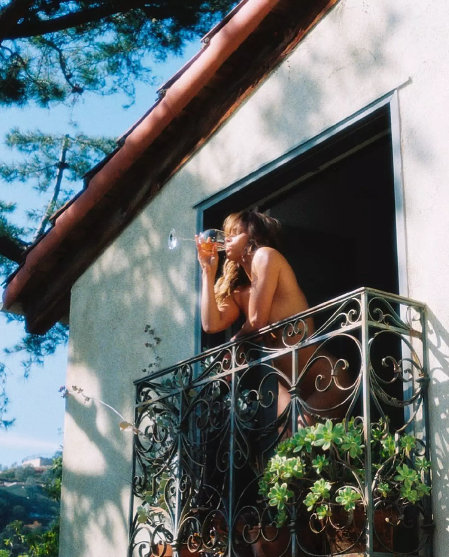 Halle Berry posted a naked photograph of herself drinking wine on a balcony on social media.