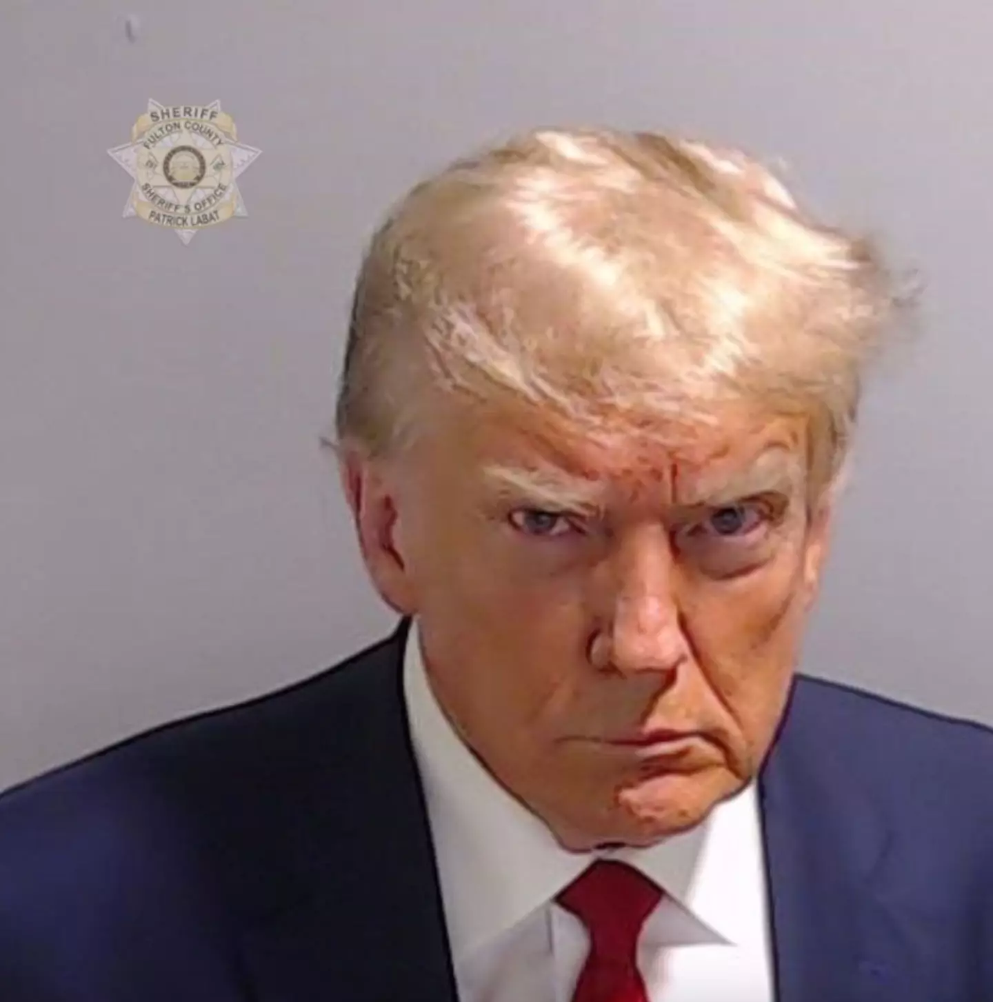 People compared Trump's inauguration photo to his 2023 mug shot (Fulton County Sheriff's Office)