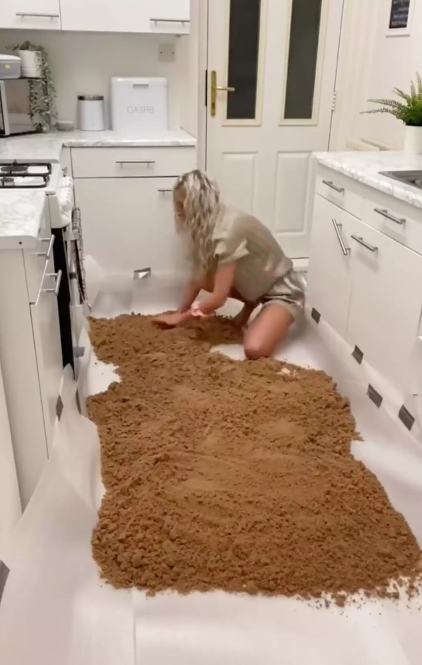 Sam covered the kitchen in sand (