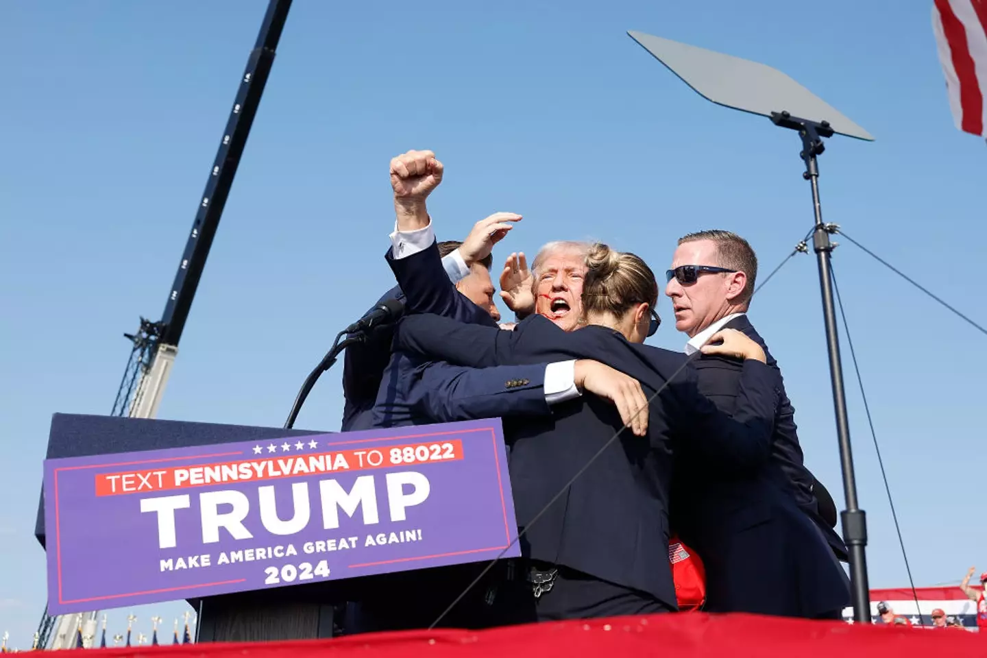 Trump defiantly didn't take cover after being shot and instead rose his fist in the air (Anna Moneymaker / Staff / Getty Images)