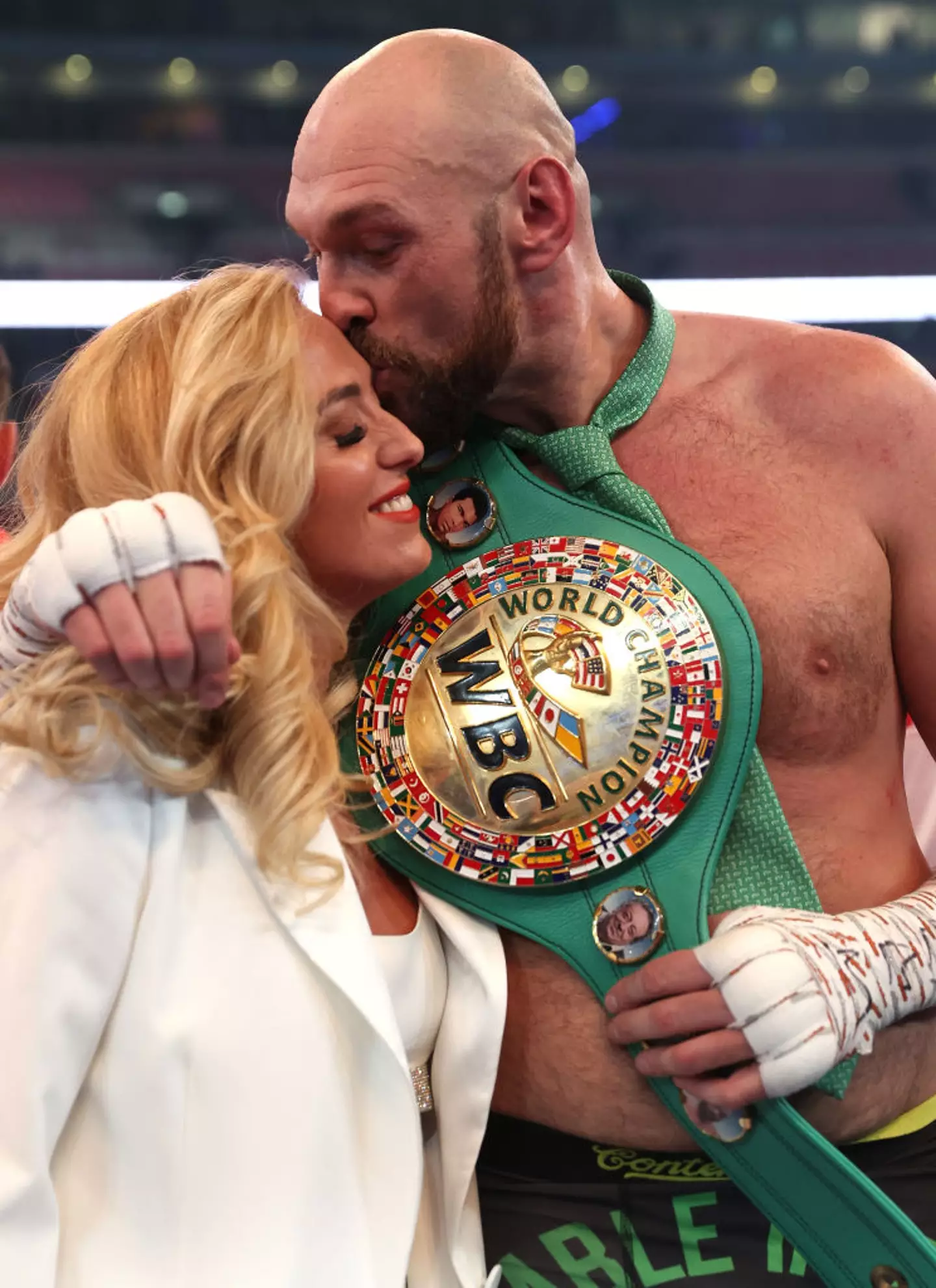 Tyson Fury celebrates victory with his wife Paris Fury after the WBC World Heavyweight Title Fight between Tyson Fury and Dillian Whyte at Wembley Stadium on April 23, 2022 in London, England. (Photo by Julian Finney/Getty Images)