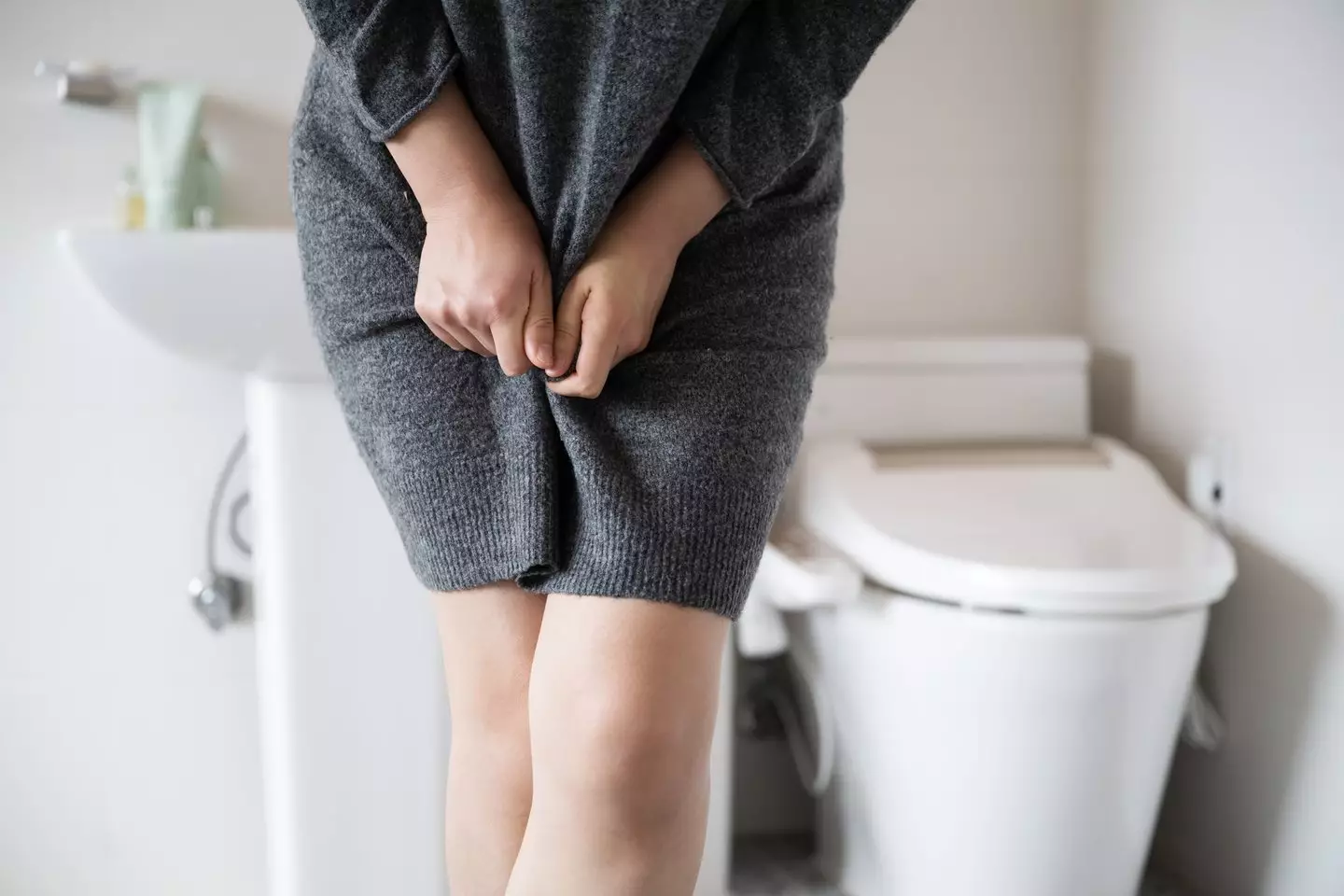 Experts have warned over a specific type of urinary incontinence if you find you're 'peeing yourself' when you go to the loo (Getty Stock Images)