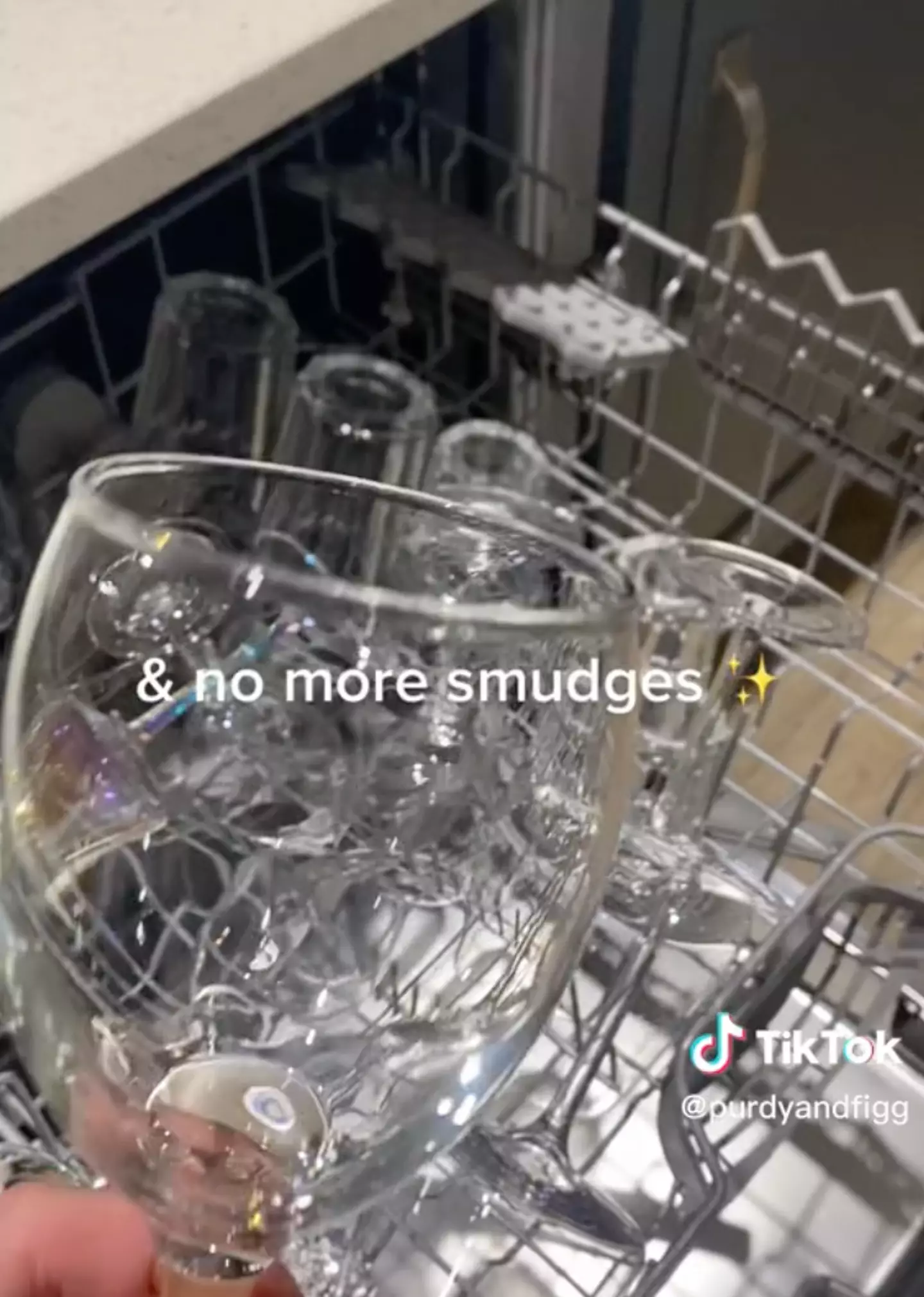 The glasses look sparkling after the foil and white vinegar are placed into the dishwasher.