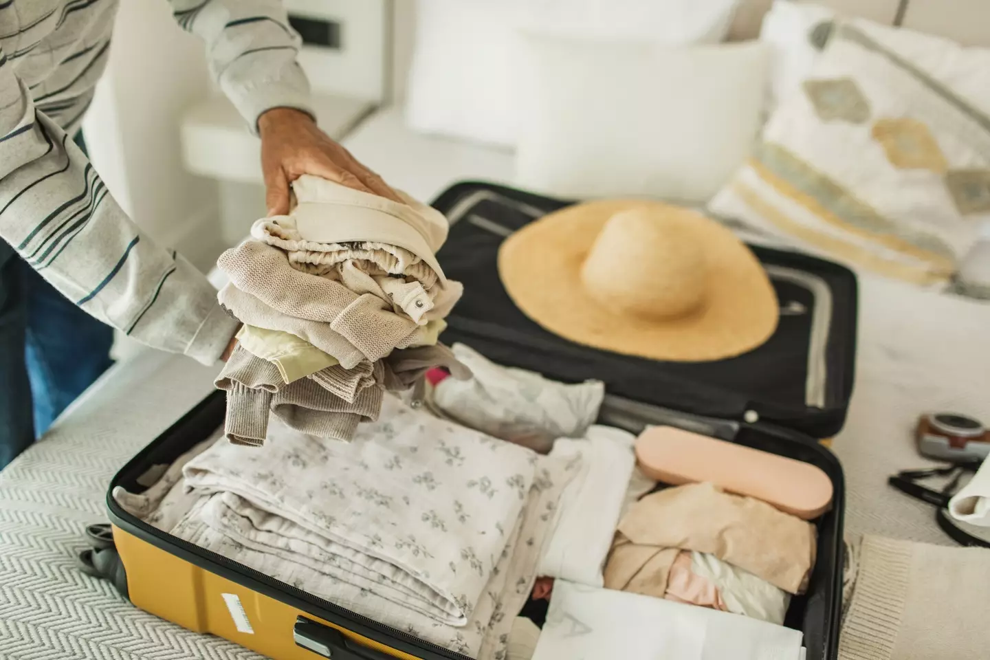 According to a baggage handler, a suitcase with two wheels is the best bet. (Getty Stock Image)