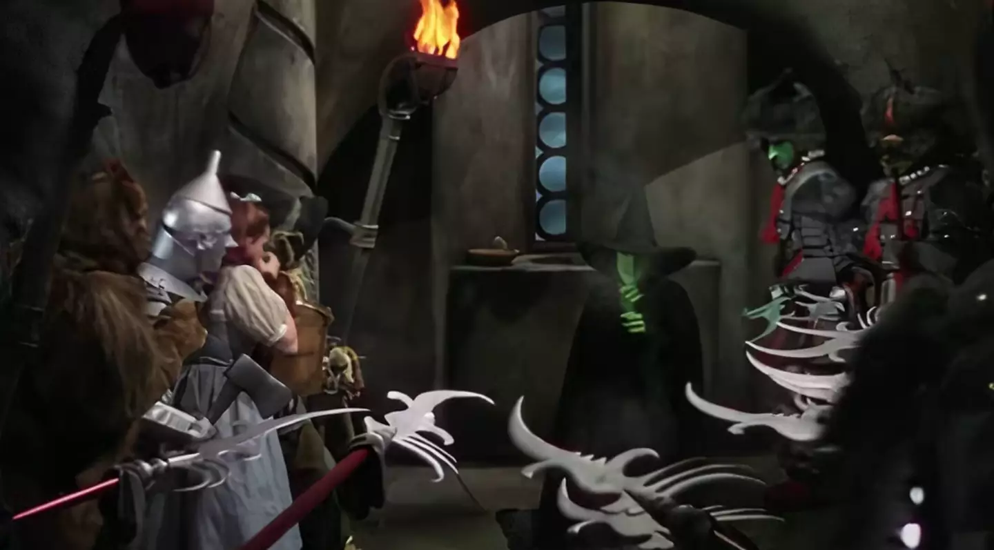 Wicked begins with the townspeople celebrating the Wicked Witch's death (Warner Bros)