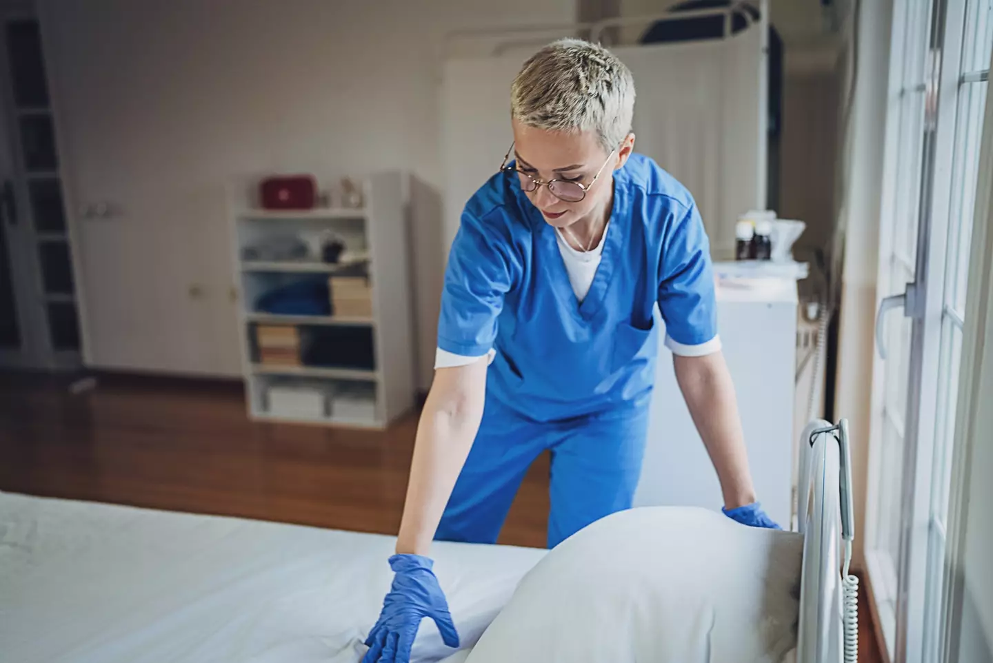 Healthcare workers are often responsible for changing infected bed sheets and towels (Getty Stock Image)