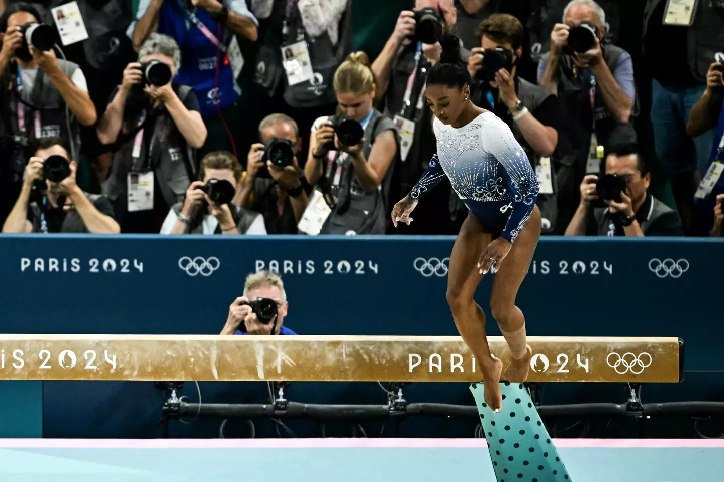 Simone seemingly suffered an injury during yesterday's performances. (LIONEL BONAVENTURE/AFP via Getty Images)