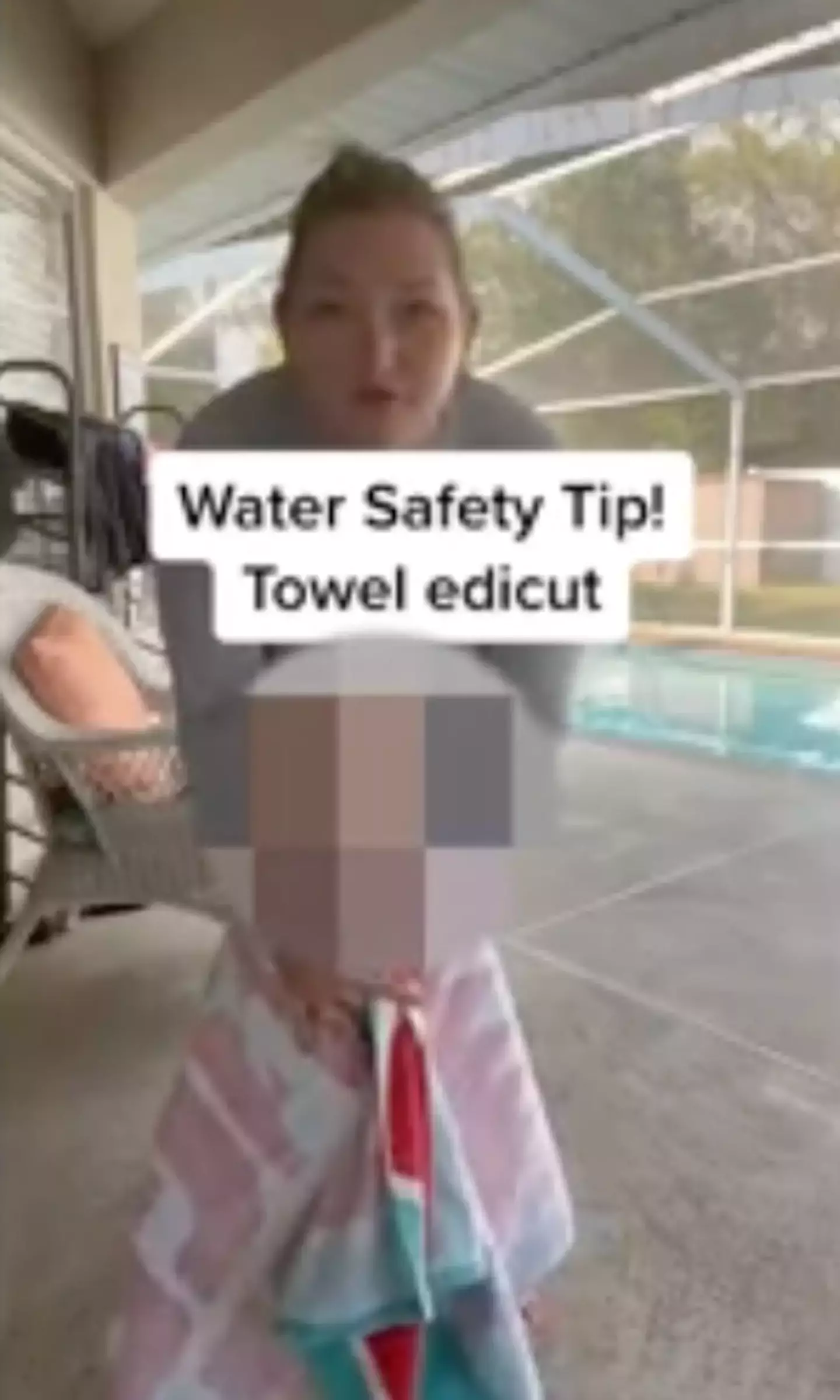 It's safer to put the towel underneath the child's arms.