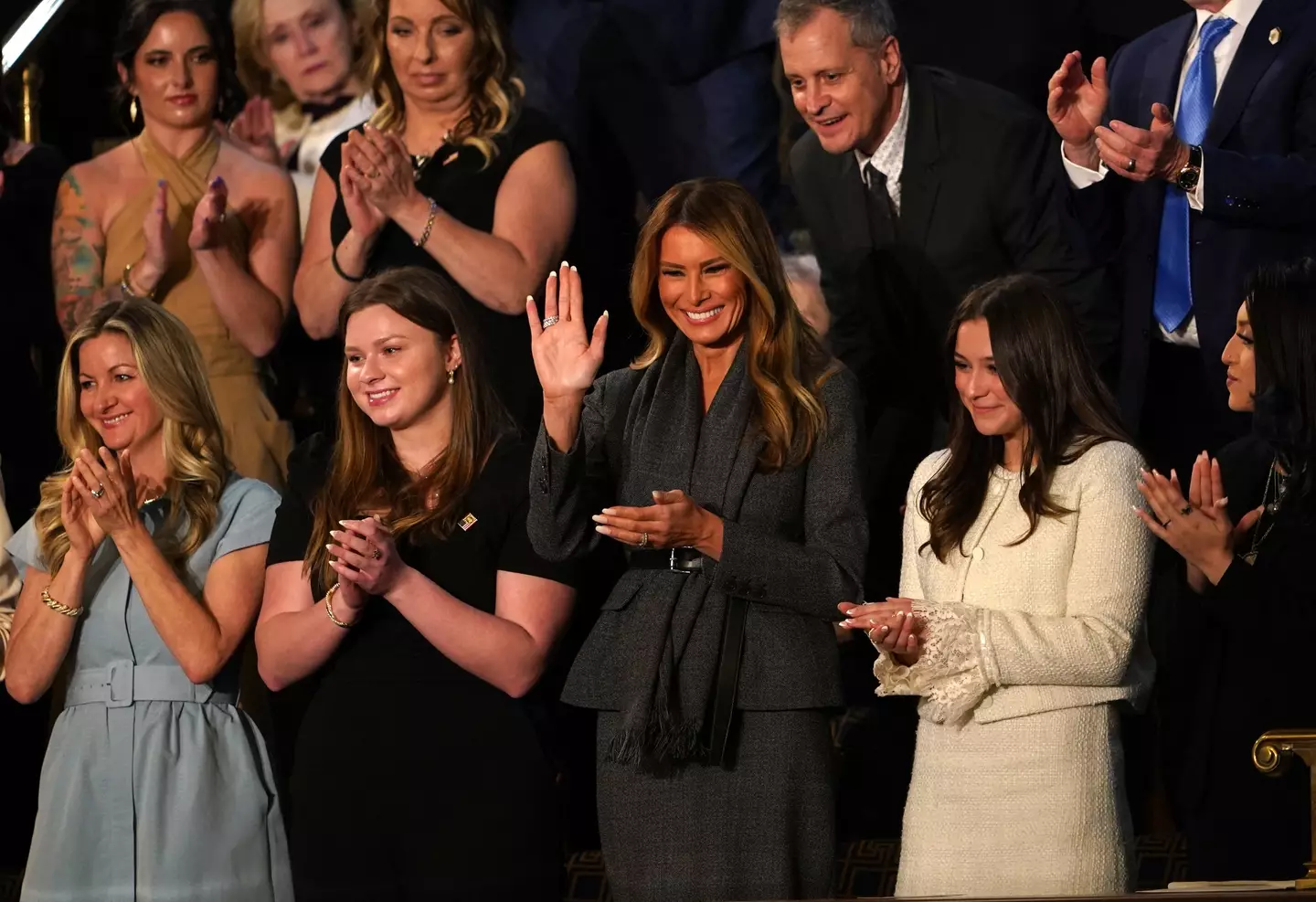 Melania stood when Trump gave her a shoutout (ALLISON ROBBERT/AFP via Getty Images)