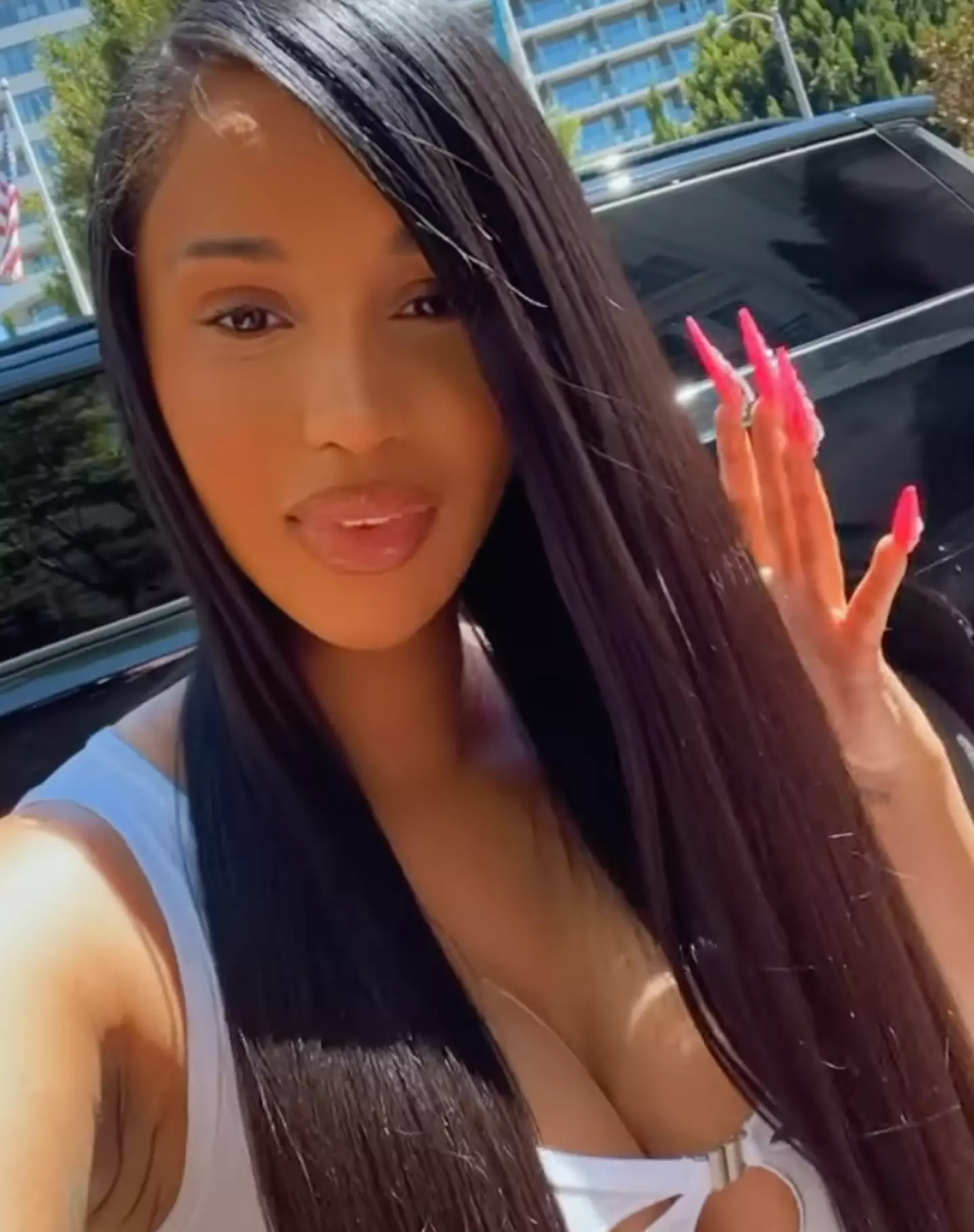 Cardi B's hair looks super sleek and long.