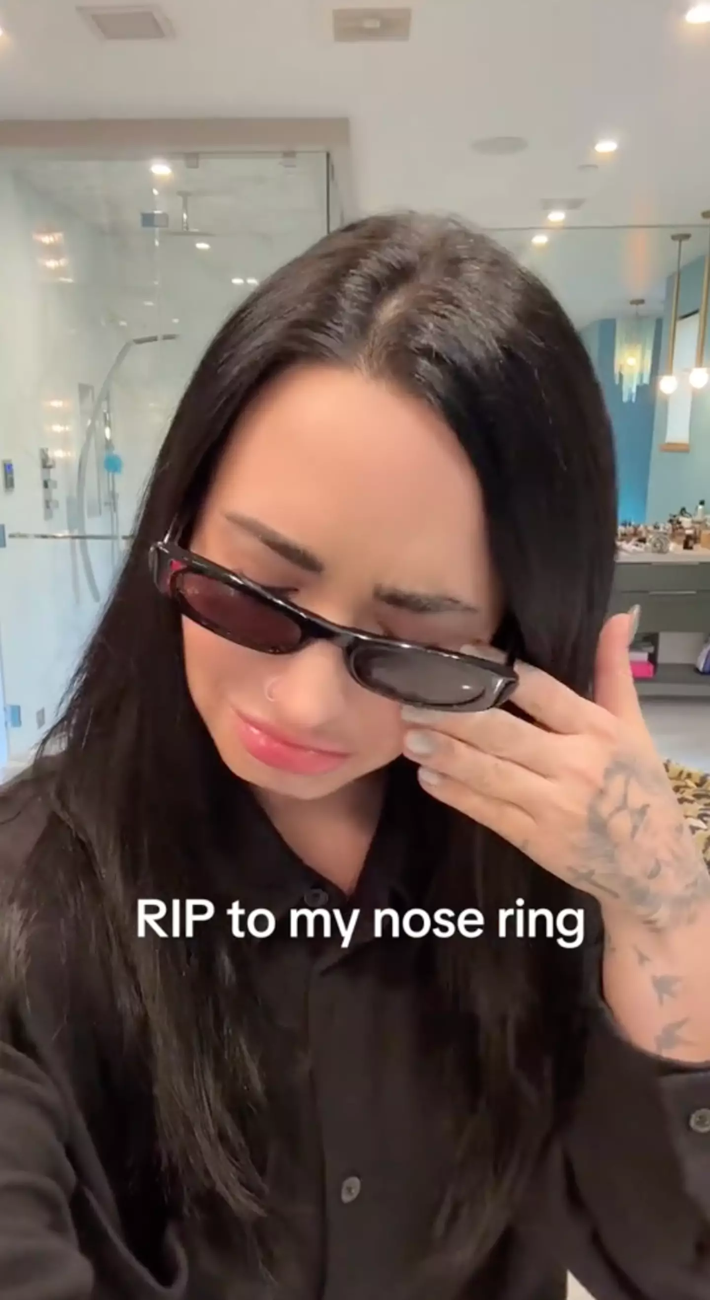 Demi Lovato filmed the process of removing her signature nose ring (TikTok/@Ddlovato)