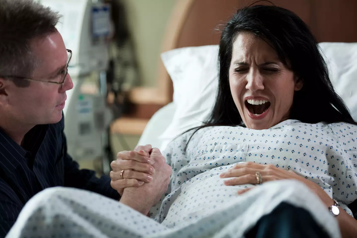 Screaming on your back in labour is what we're used to seeing when people depict birth. (Getty Stock Images)
