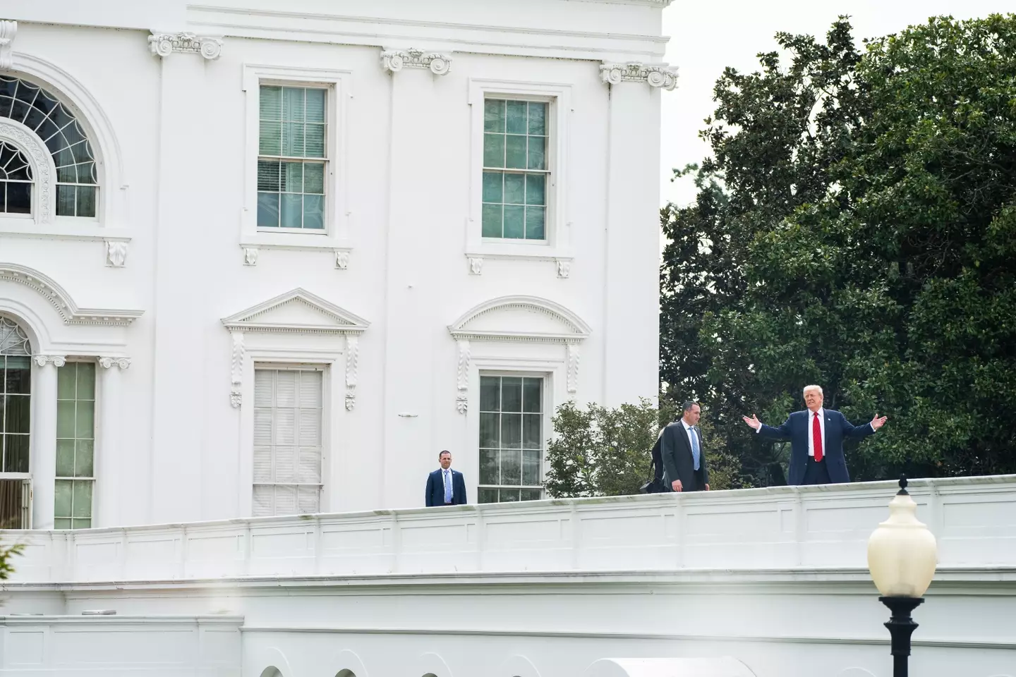 Donald Trump left reporters baffled after he was seen 'taking a little walk' on the White House roof on Tuesday (5 August) (Demetrius Freeman/The Washington Post via Getty Images)