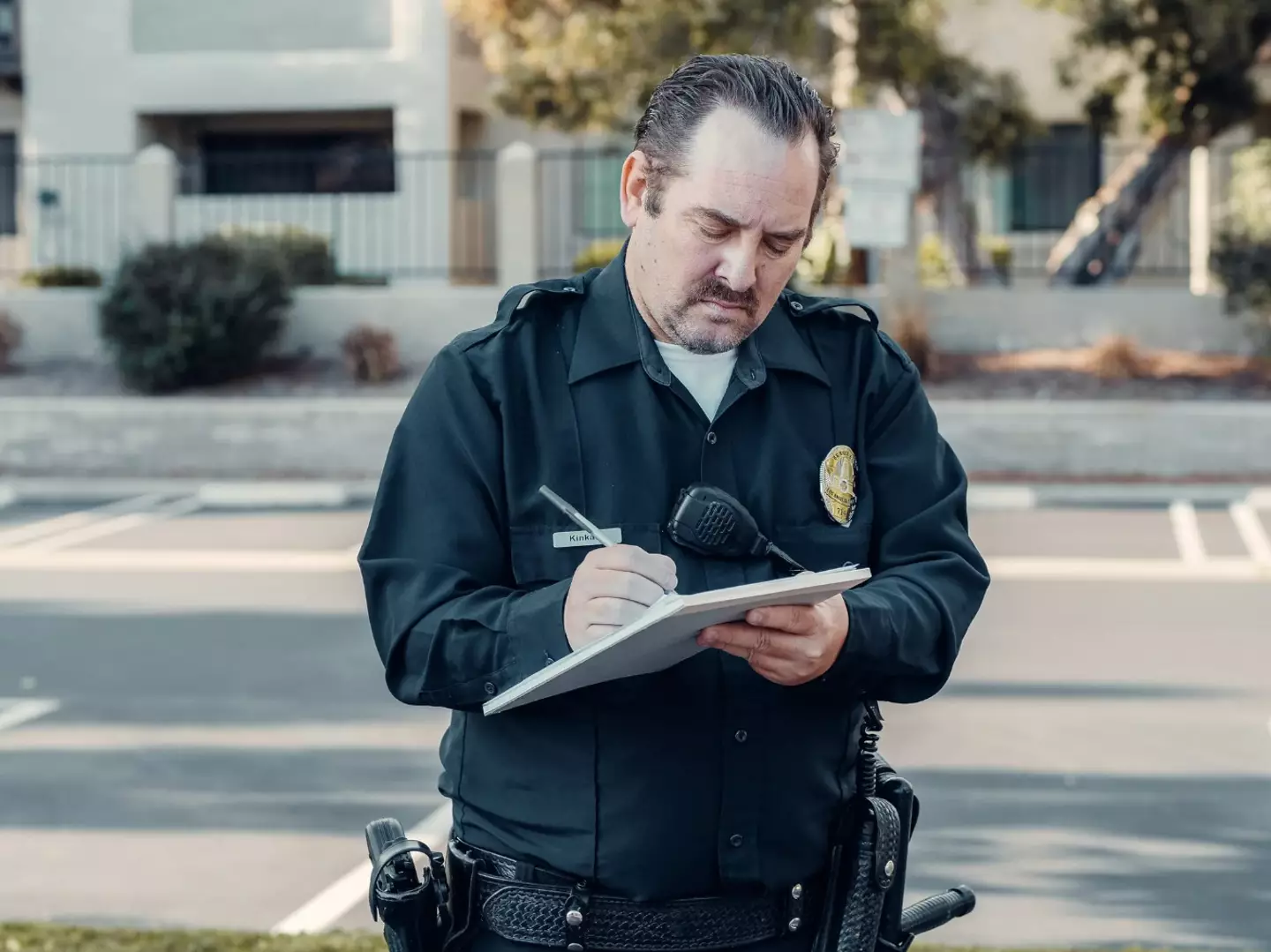 A police officer giving a ticket.