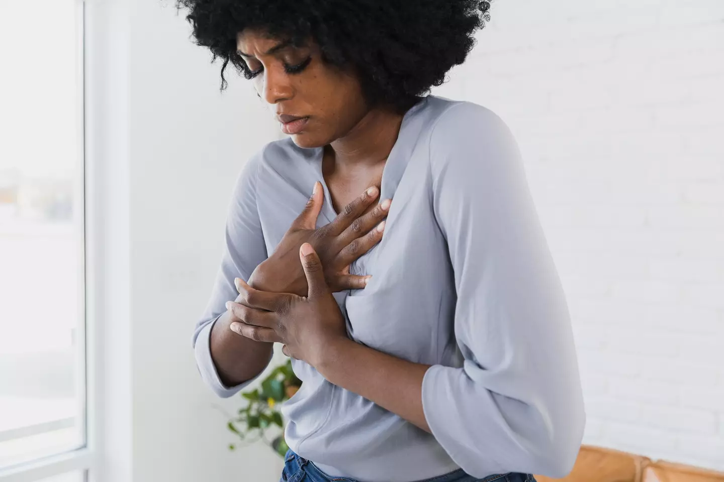 Chest pain is the most common heart attack symptom. (SDI Productions / Getty Images)