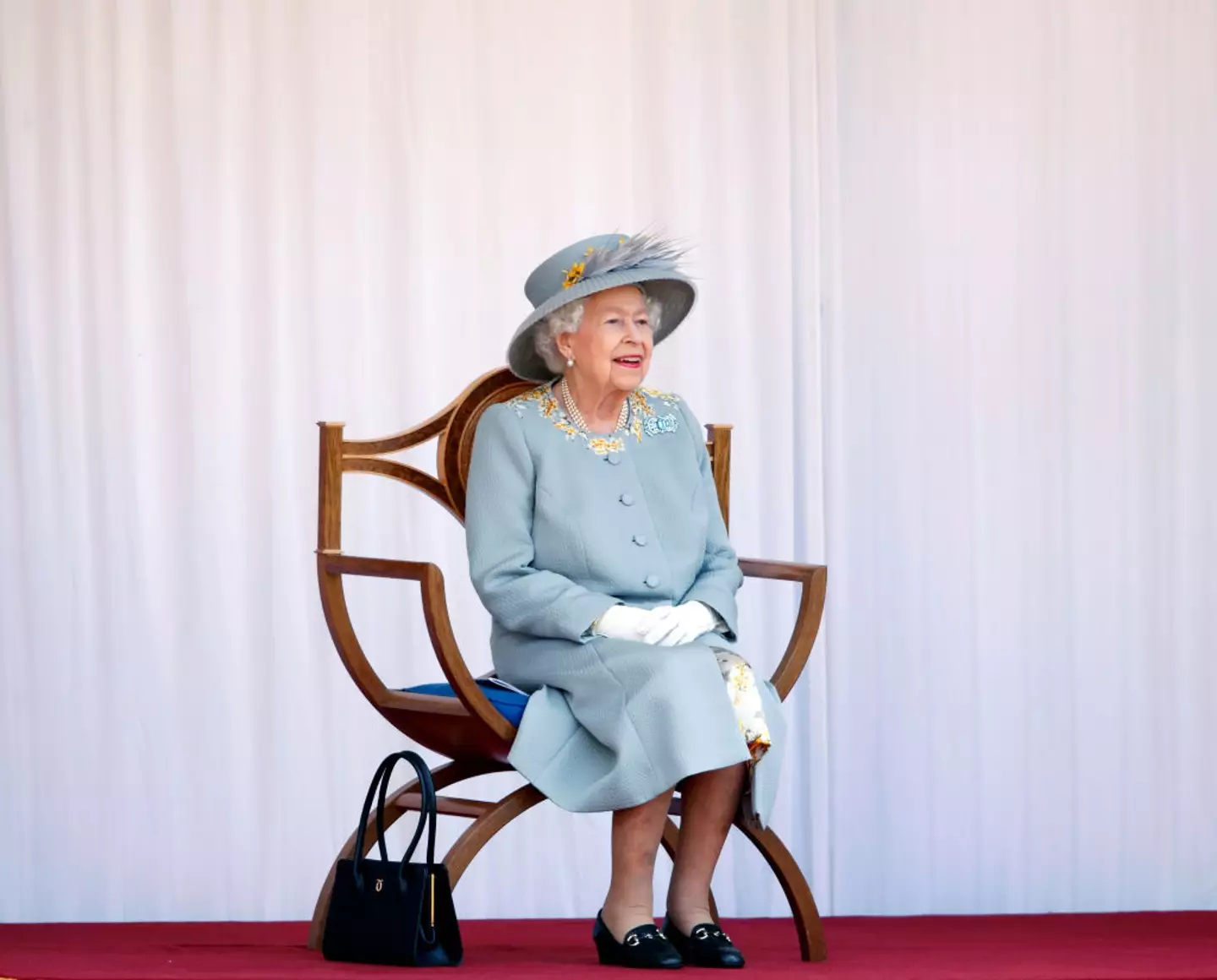 The Queen would also use her handbags as signals, too. (Max Mumby/Indigo - Pool/Getty Images)