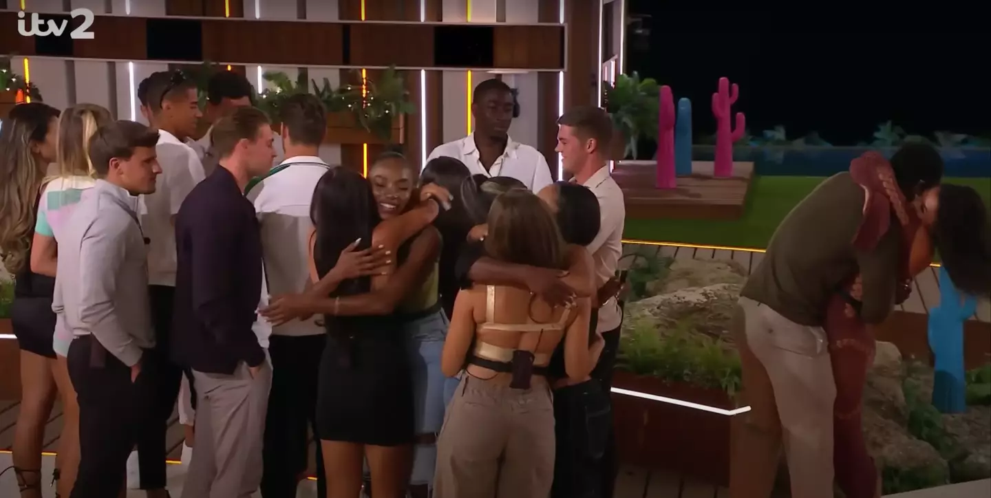 Fans noticed Paige and Dami's (far right) hug after he was saved.