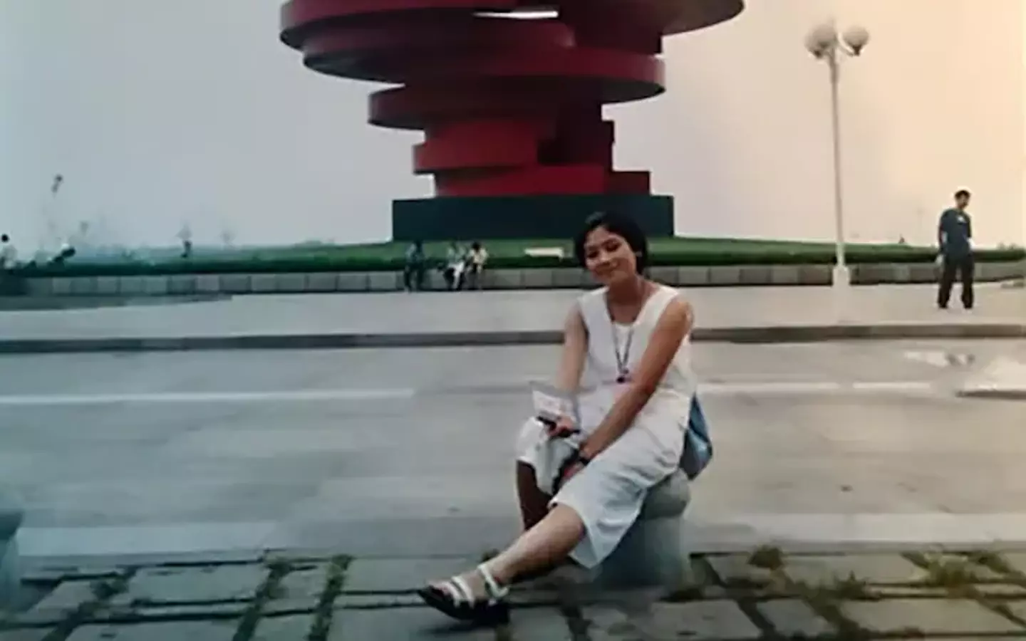 Xue took a picture in front of the sculpture in May Fourth Square (ChannelNewsAsia)