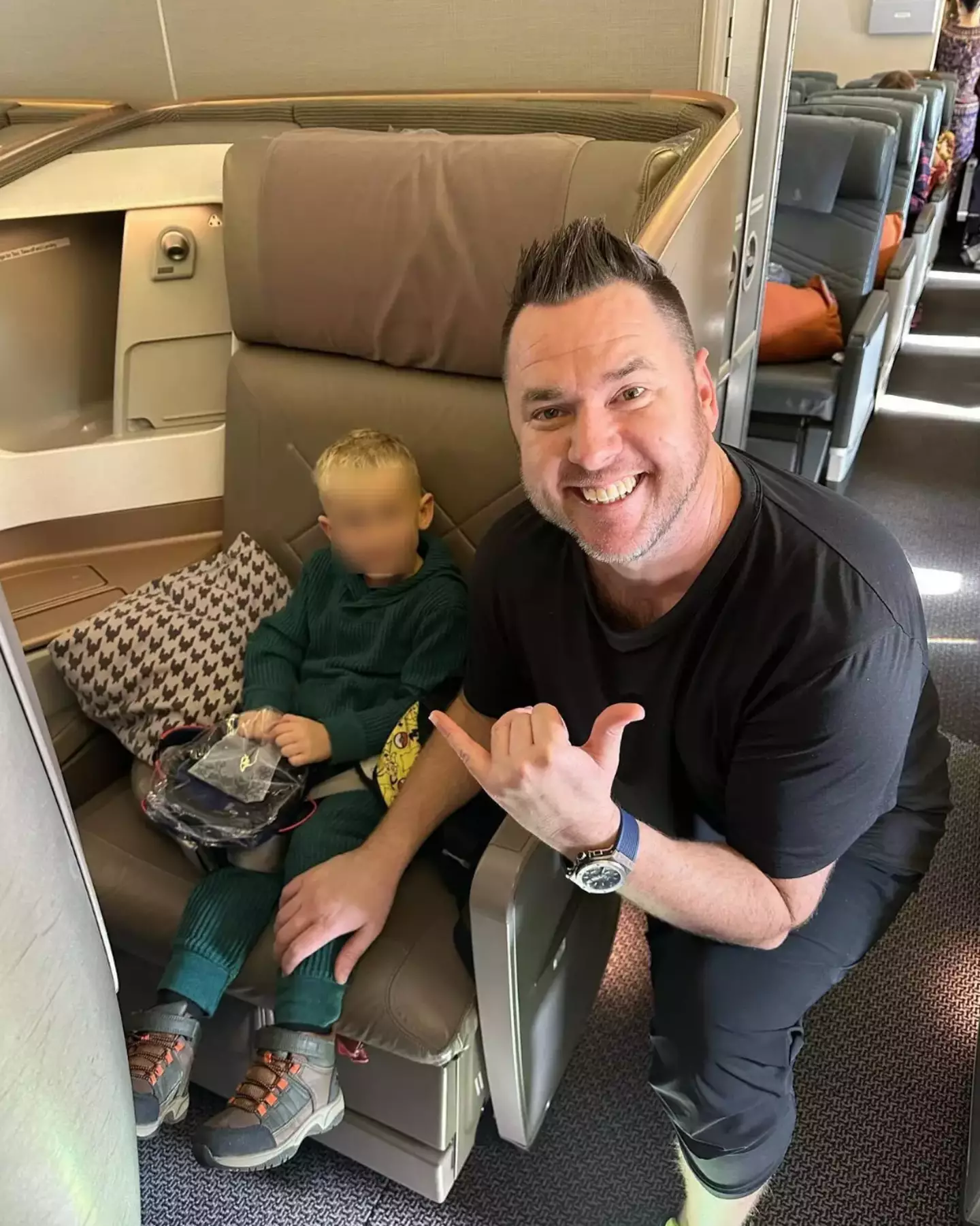 Michael Rutherford shared a clip of a flight attendant feeding his son during a flight to Tokyo.
