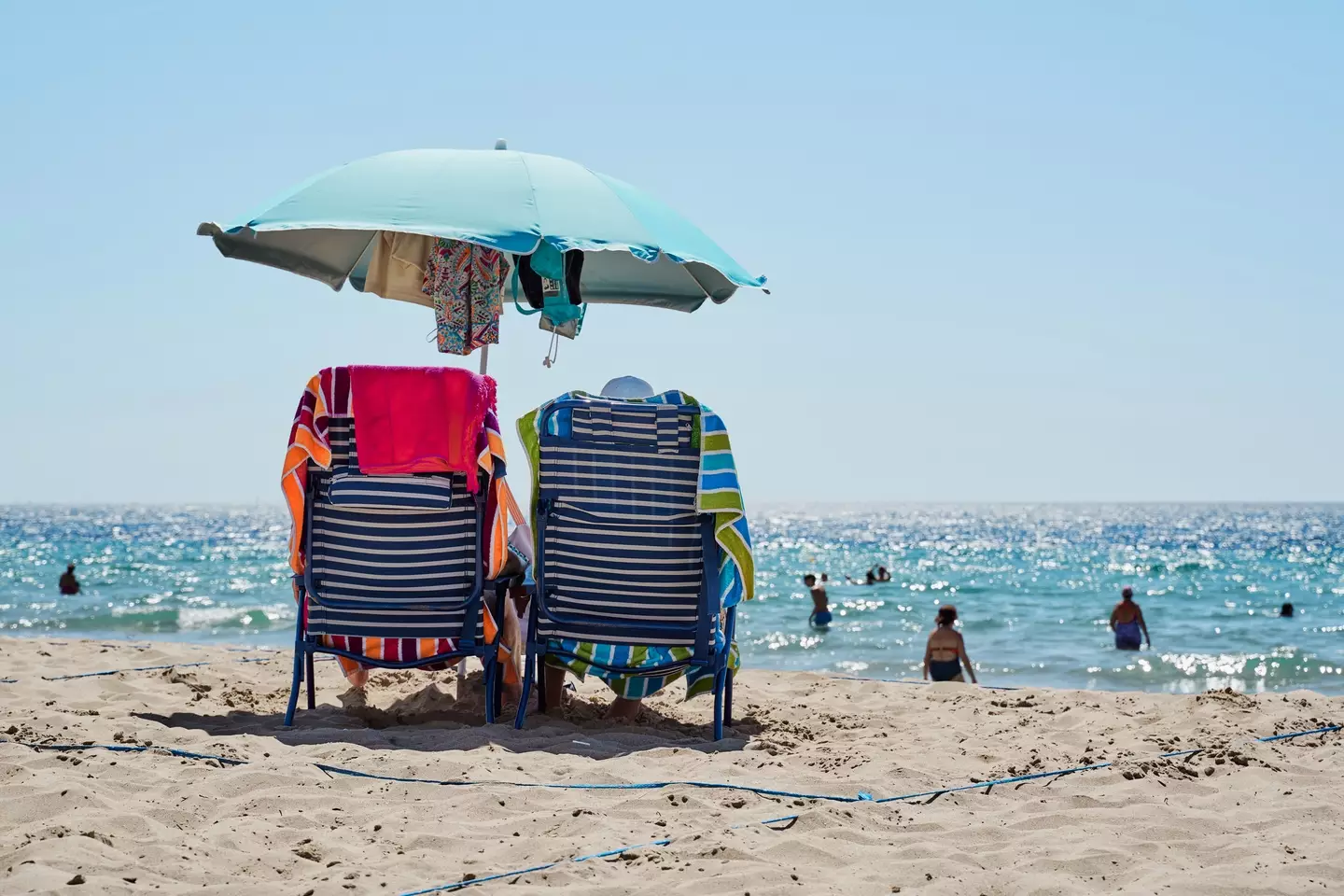 Want to reserve a space with a parasol? Think again or cough up (Getty Stock Image)