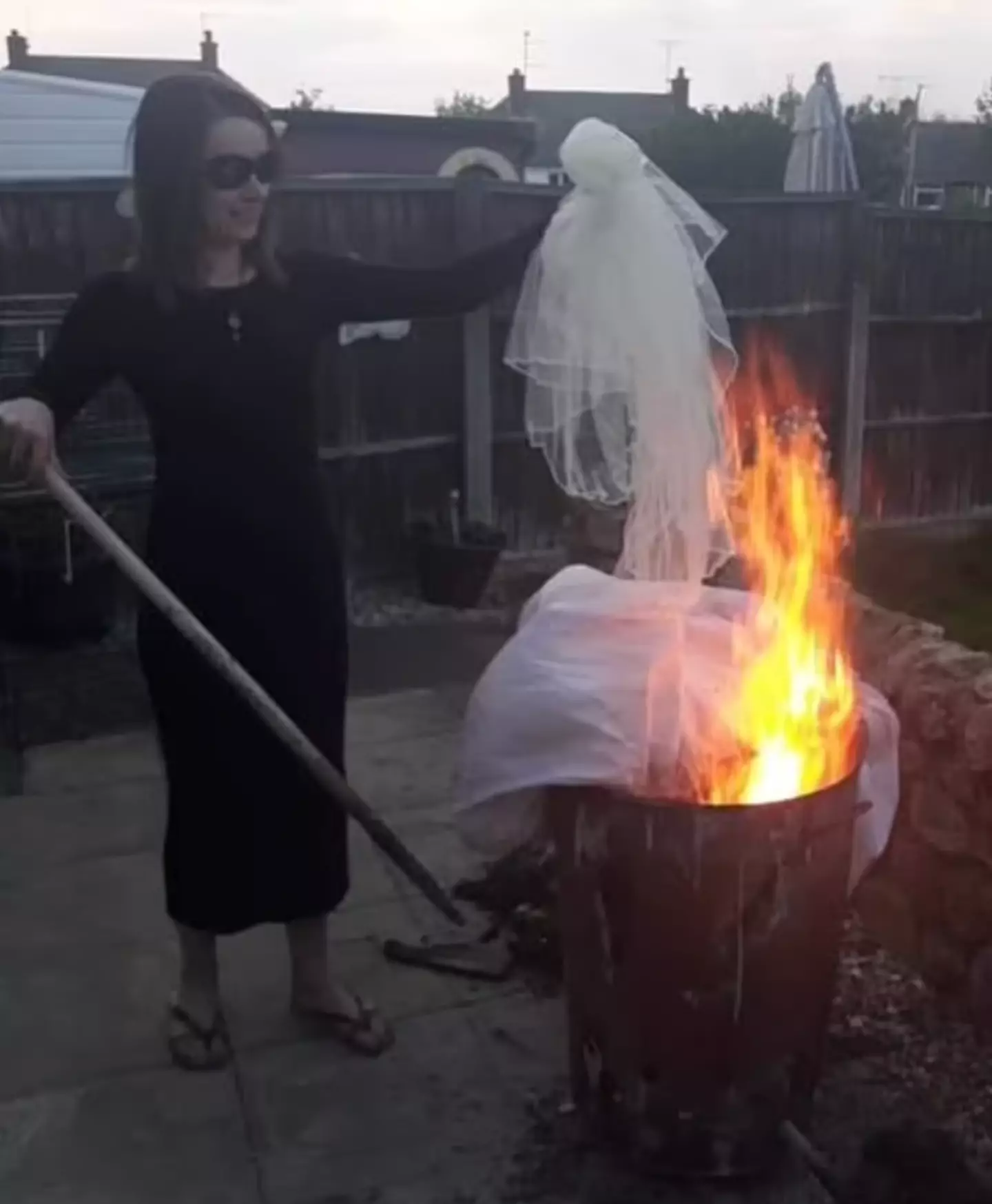 Emma burned her dress in a bin.