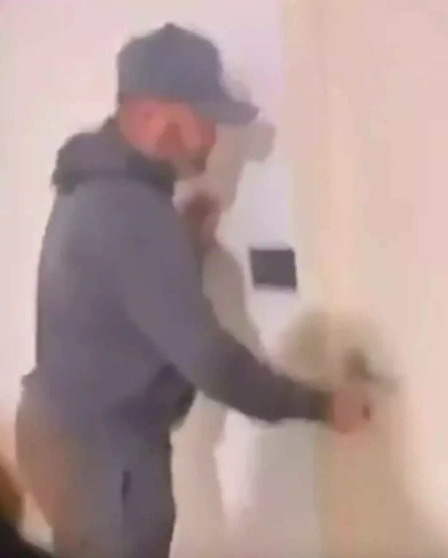 Rooney can be seen unlocking a door in the clip (X)