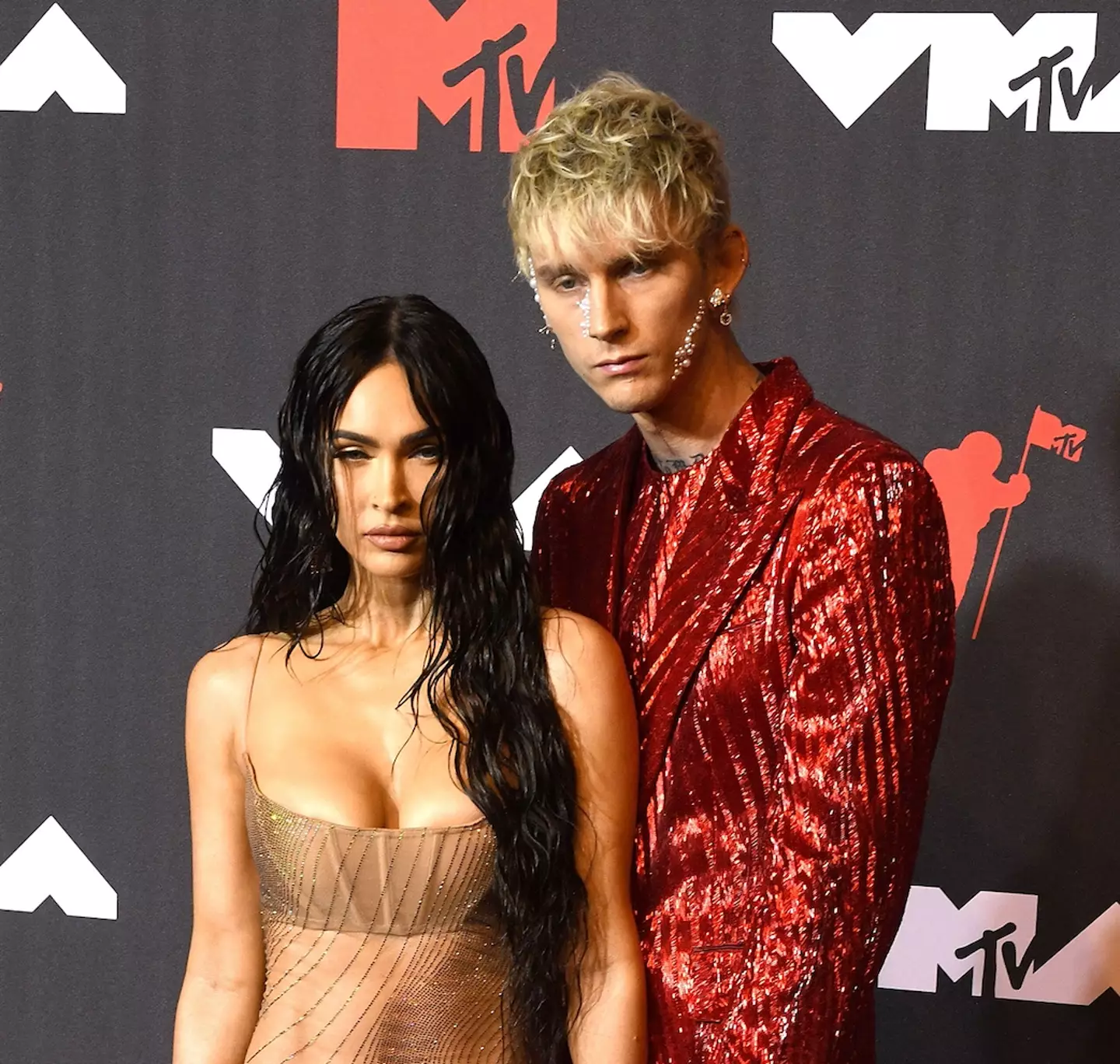 Megan and Machine Gun Kelly drink each other's blood. (