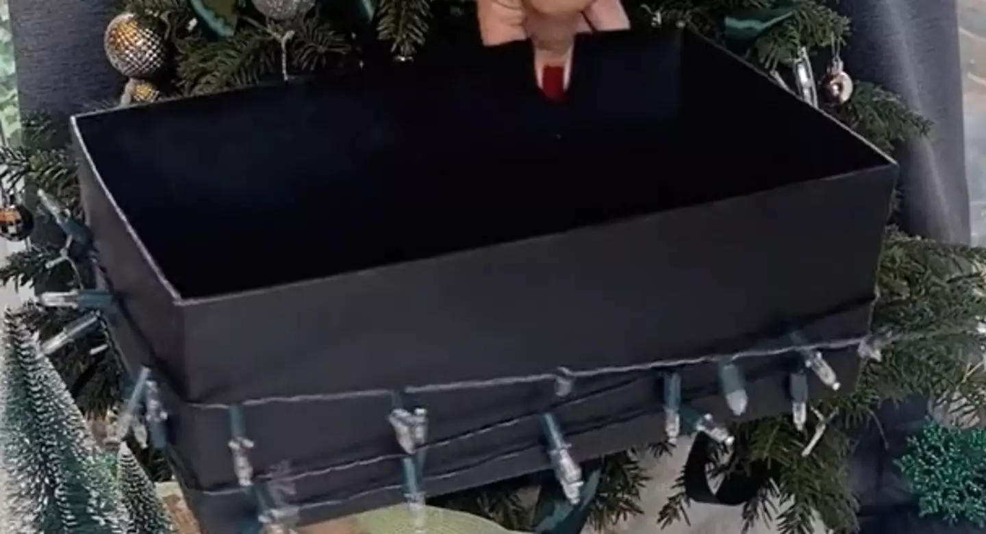 Once you've wrapped the lights around, cut a small slit in the box so you can store the battery/power pack inside.