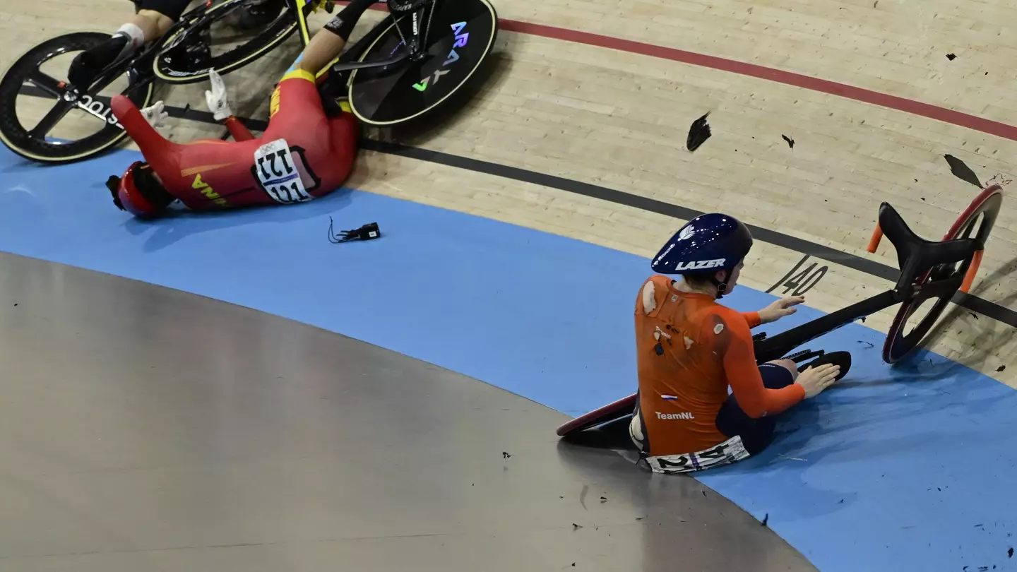 The medical team rushed onto the track. (JOHN MACDOUGALL/AFP via Getty Images)